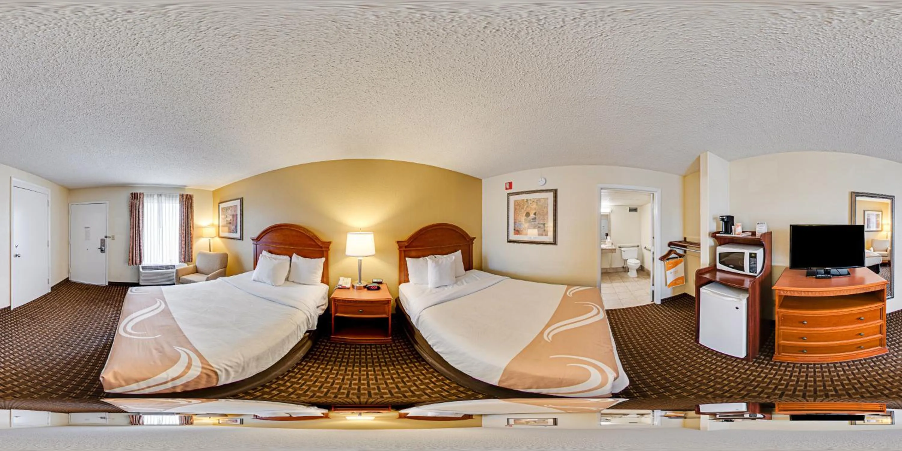 Bed in Quality Inn North