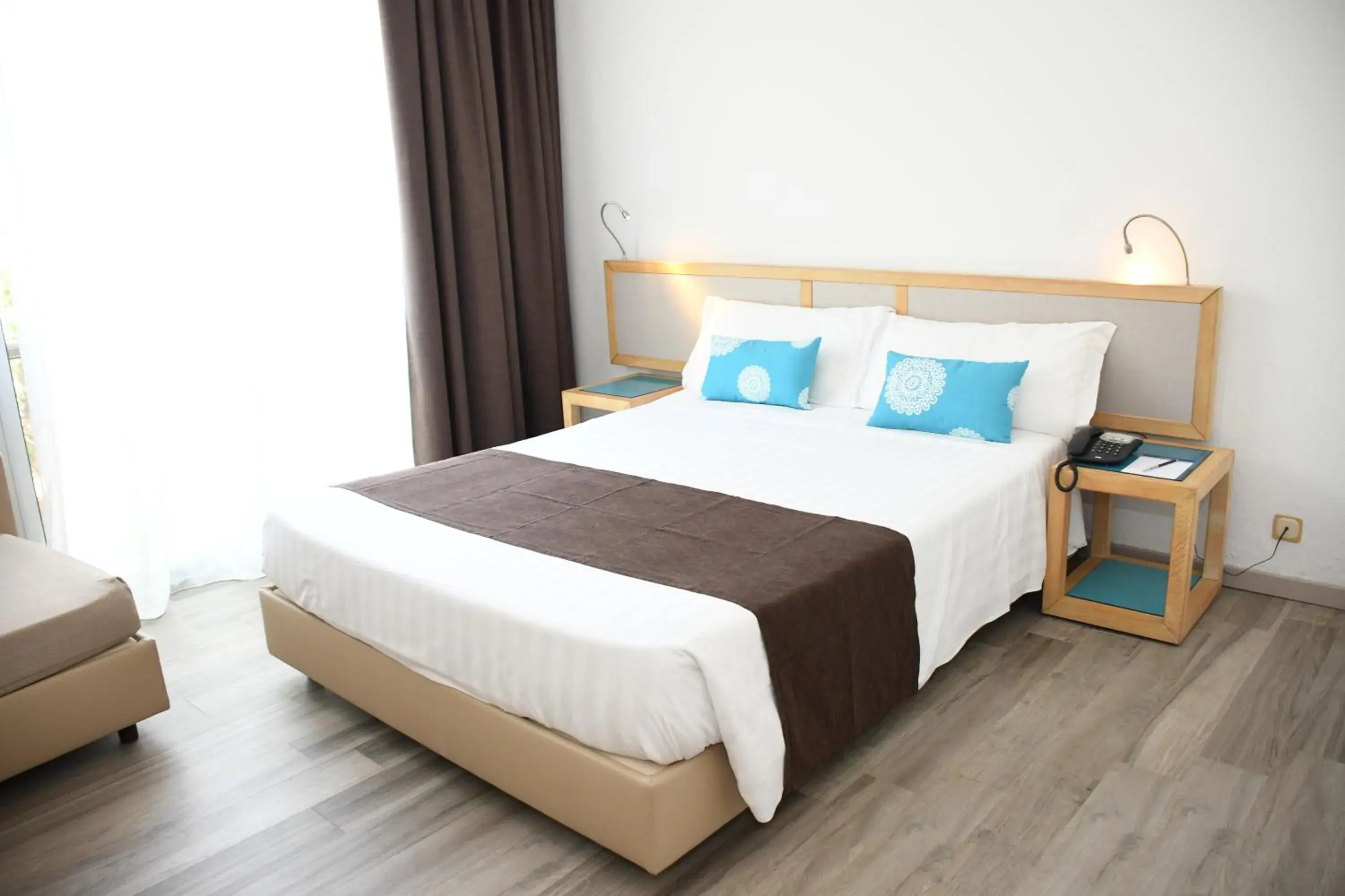 Triple Room in Baia di Conte Resort Triple Room in Baia di Conte Resort