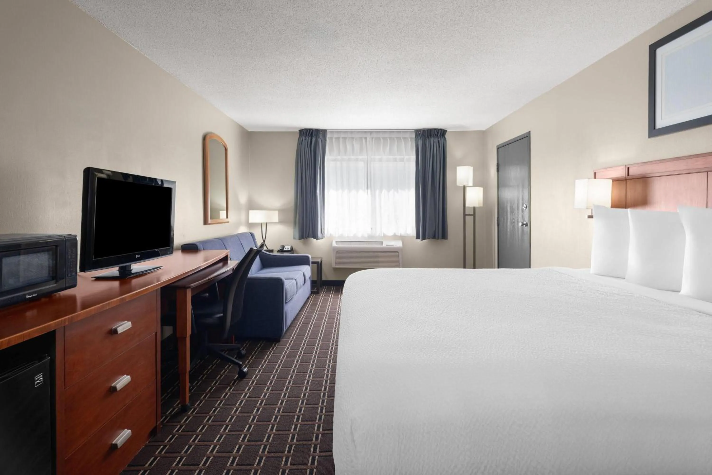 Photo of the whole room, Bed in Travelodge by Wyndham Fargo