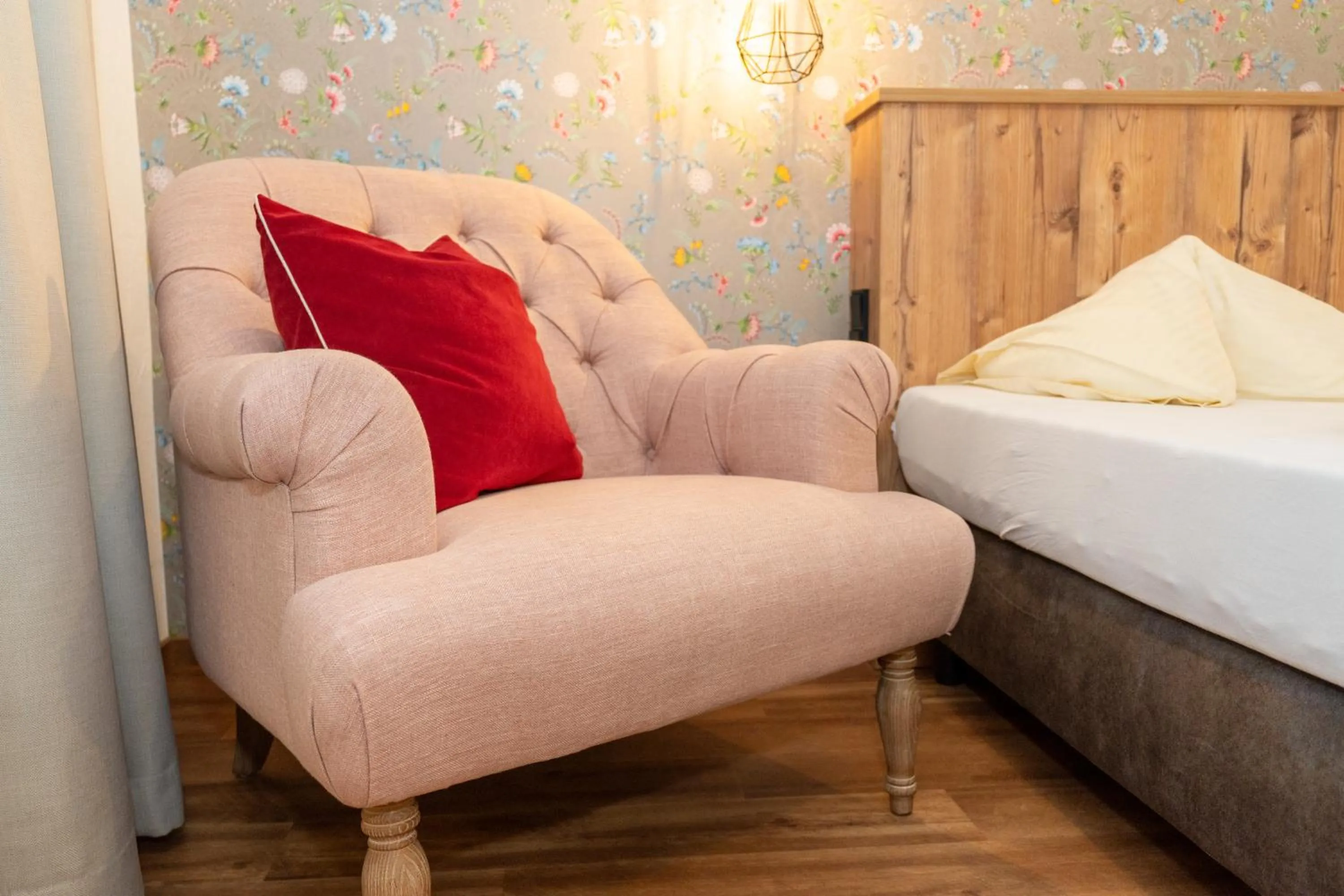 Seating area, Bed in Hotel Krone Tirol