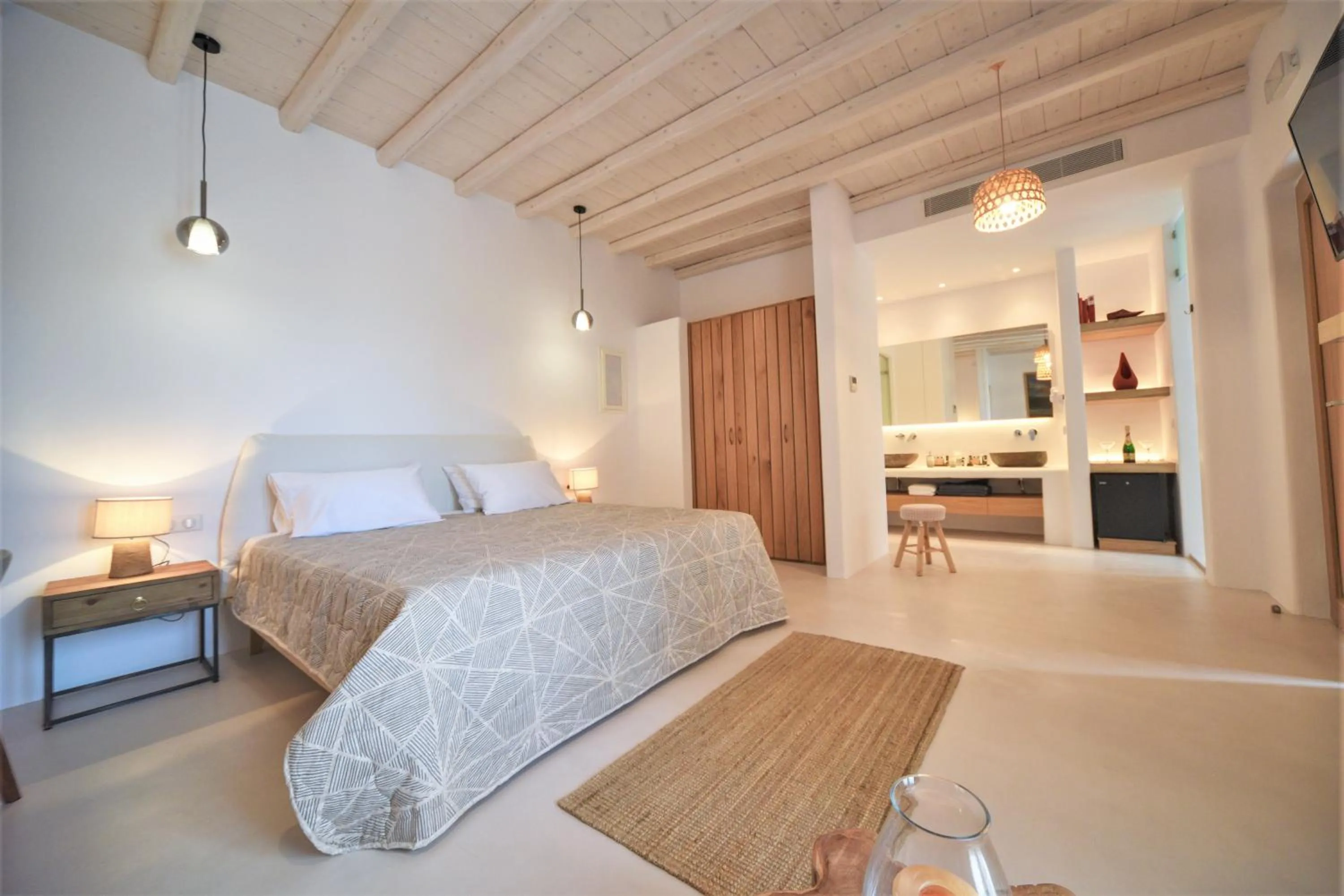 Bed in Myconian Crown Suites