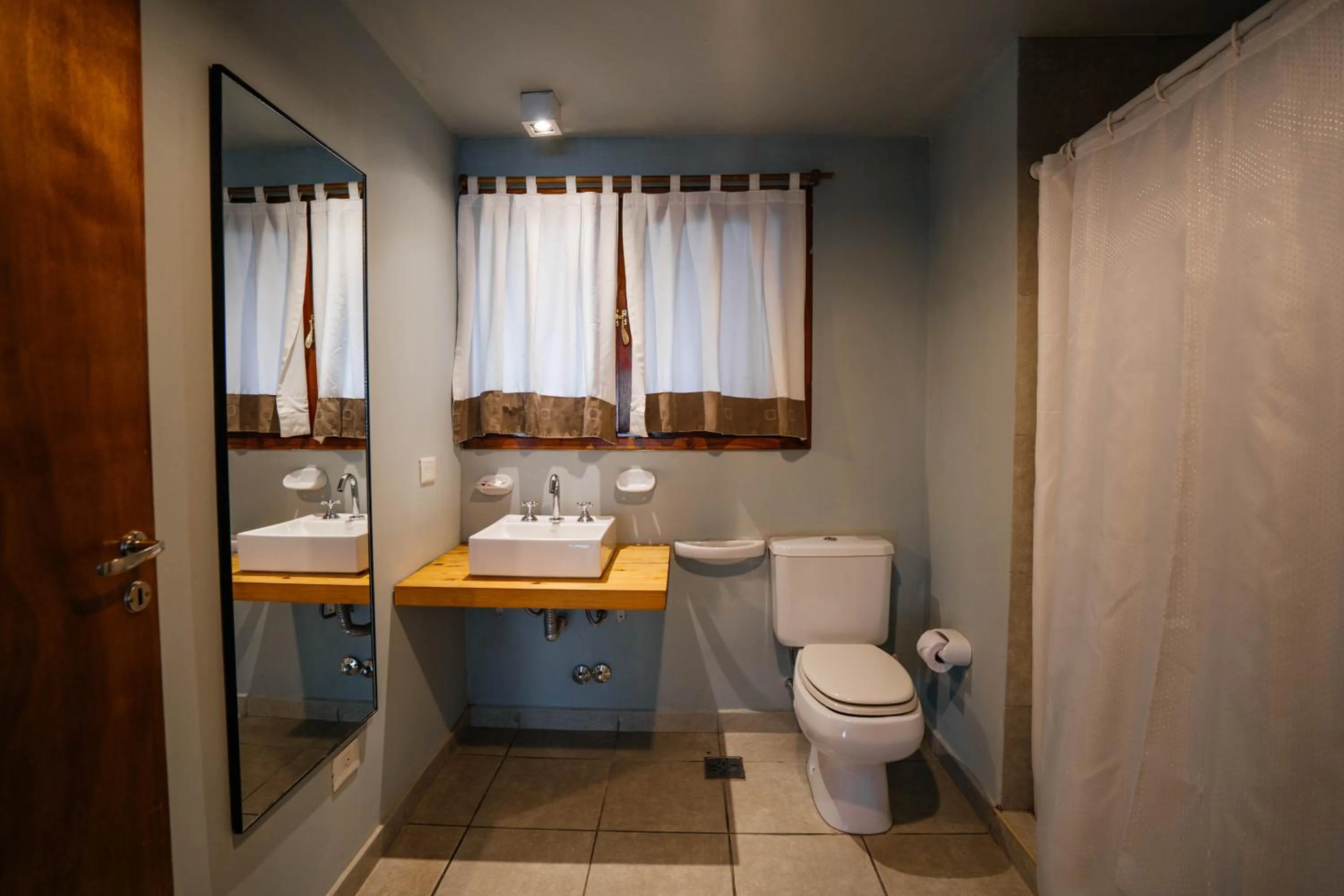 Bathroom in Pioneros Suites by Grupo Tierra Gaucha