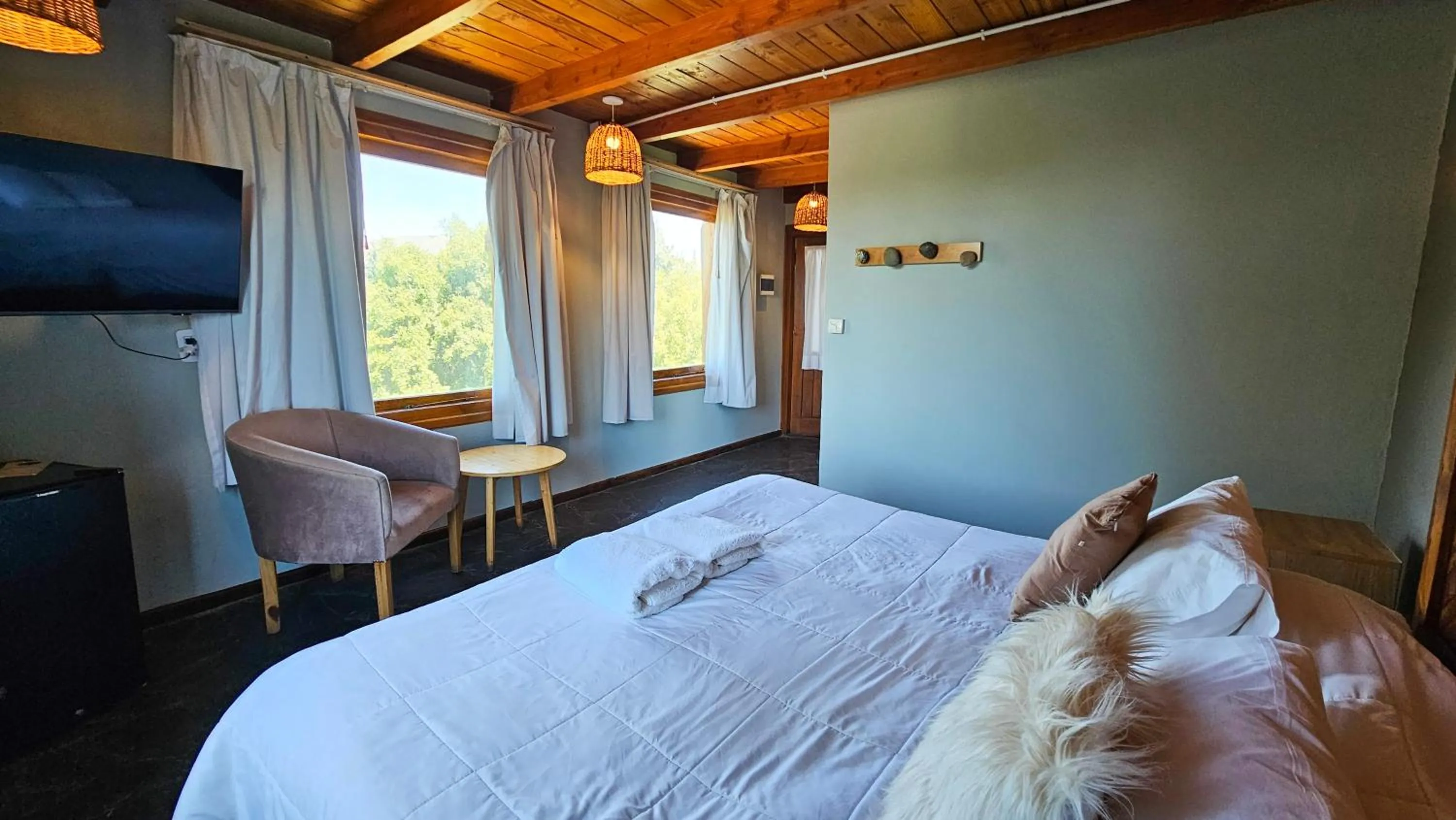 Bed in Pioneros Suites by Grupo Tierra Gaucha