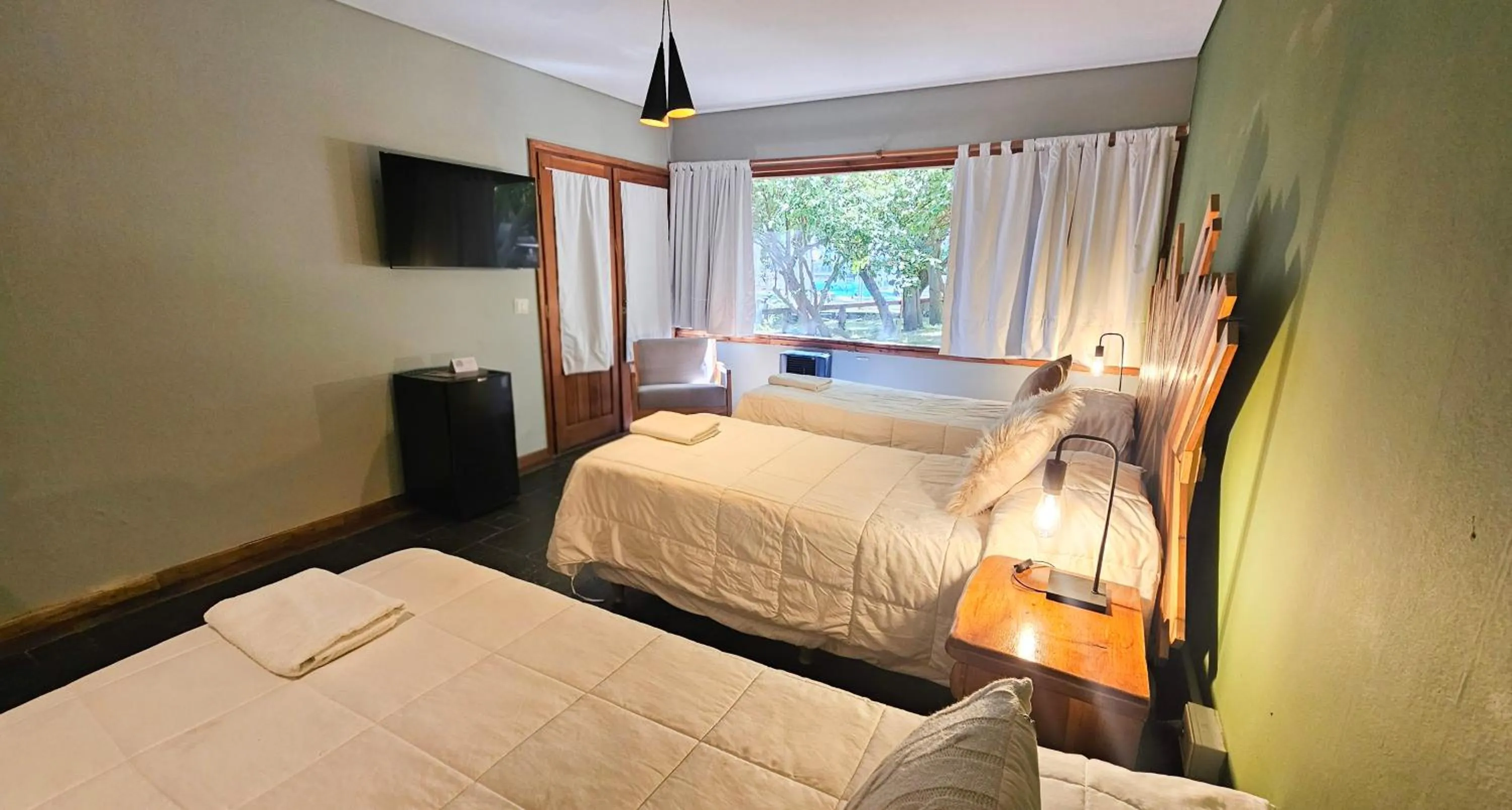 Bed in Pioneros Suites by Grupo Tierra Gaucha