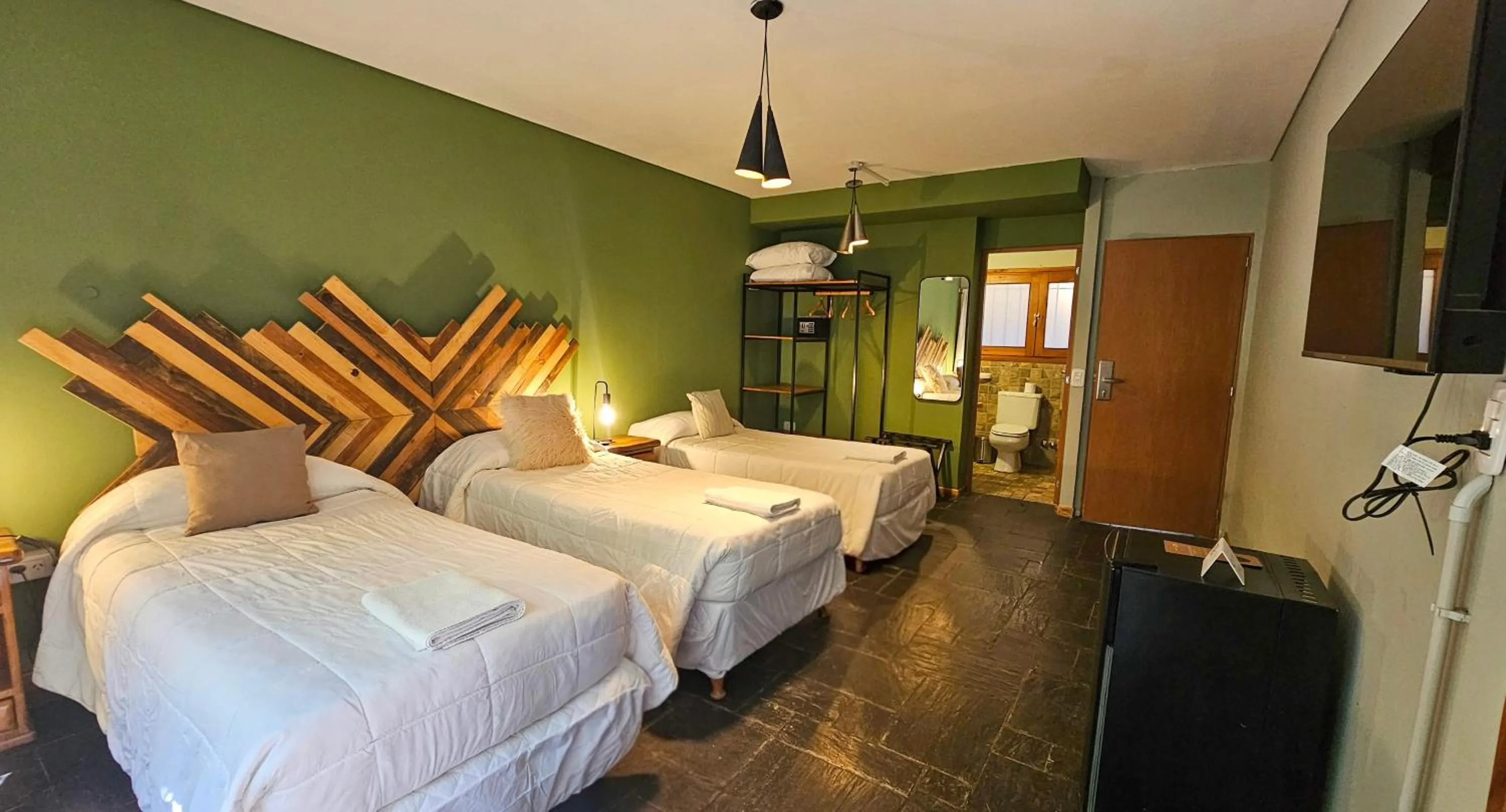 Bed in Pioneros Suites by Grupo Tierra Gaucha