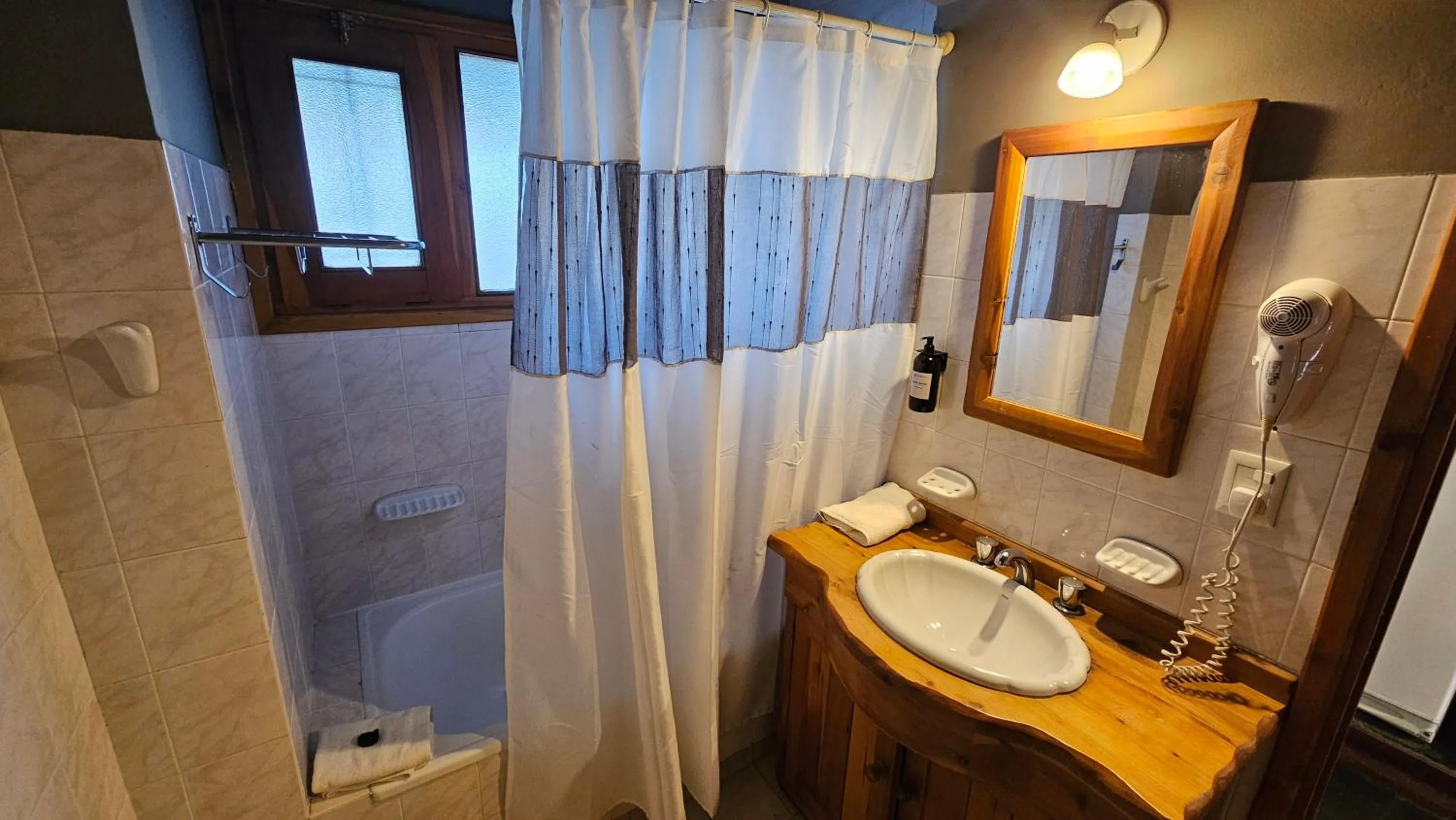 Bathroom in Pioneros Suites by Grupo Tierra Gaucha