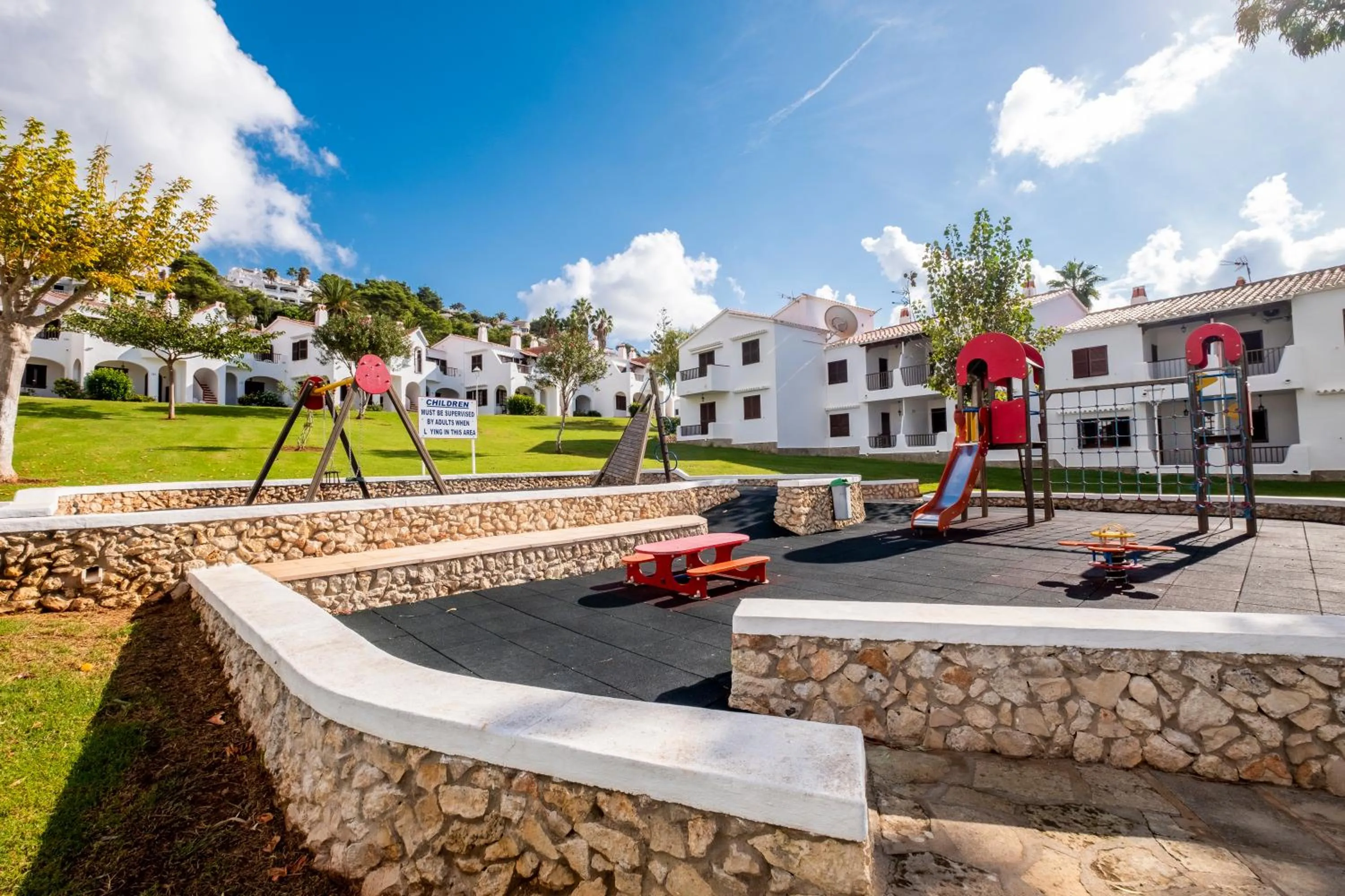 Children play ground in Apartamentos Son Bou Gardens By MENORCARENTALS