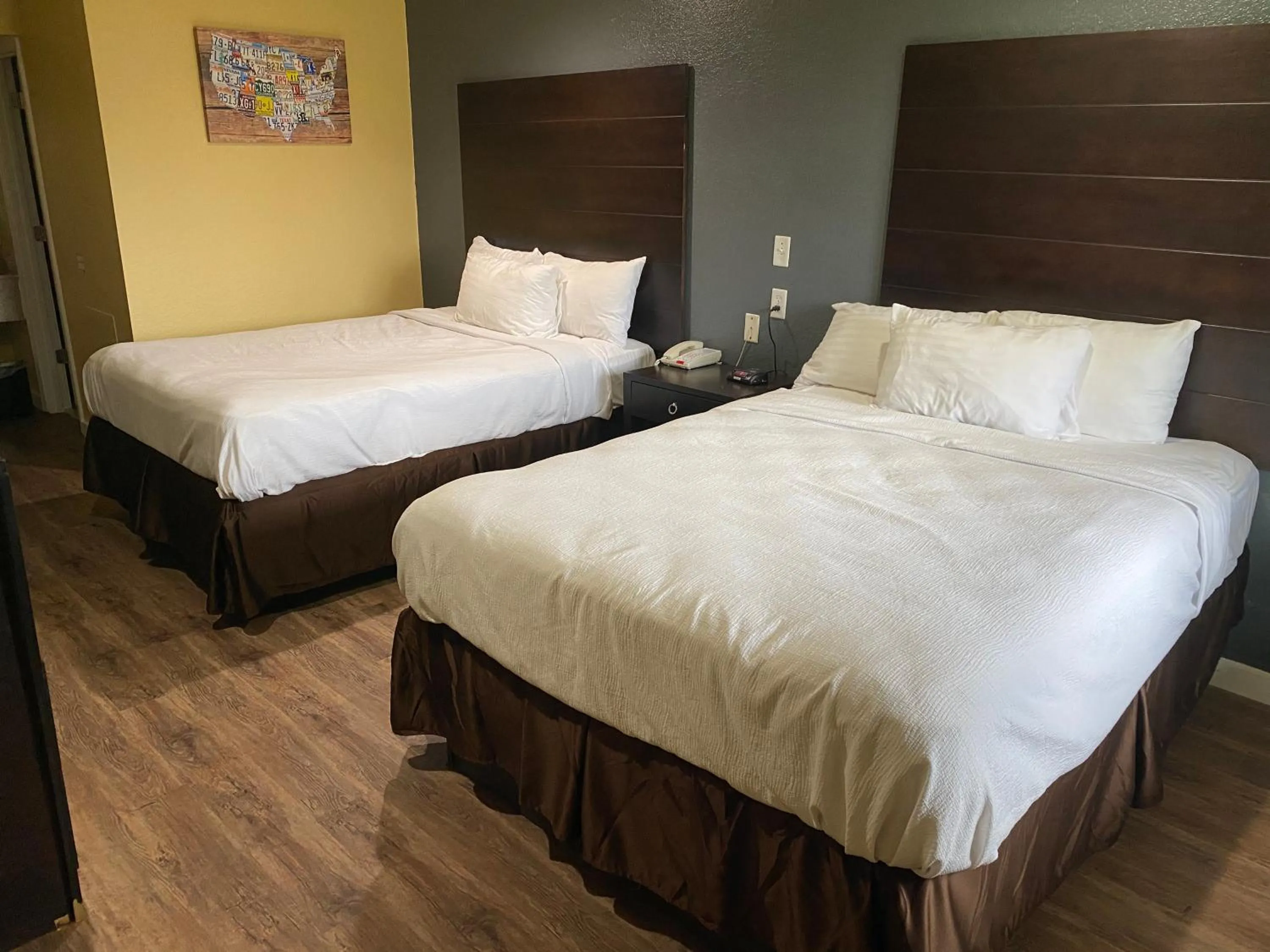 Bed in Woodridge Inn and Suites