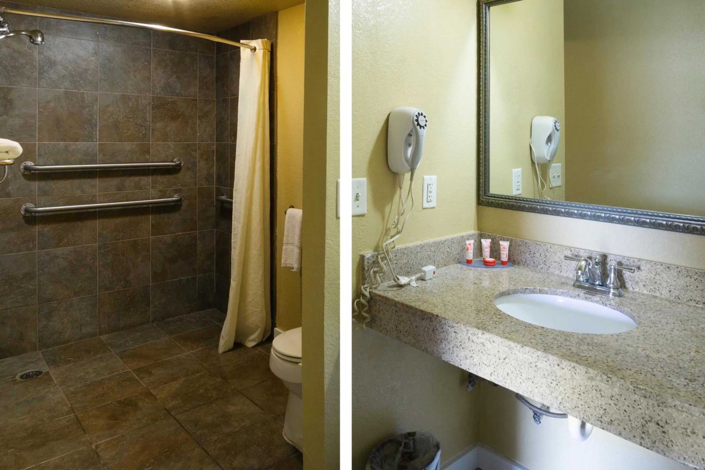 Bathroom in Woodridge Inn and Suites