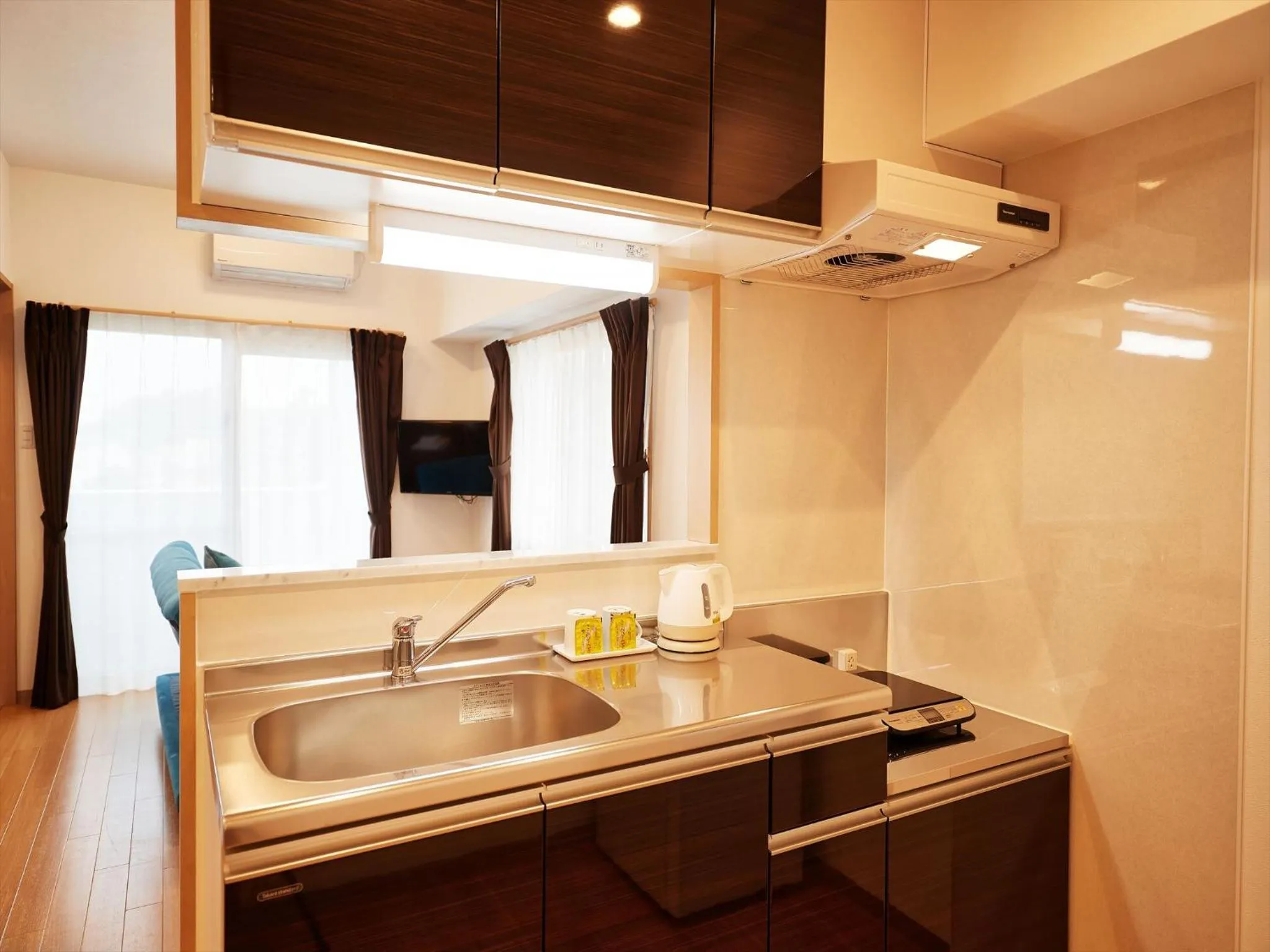 Kitchen or kitchenette in M´s Stay Okinawa