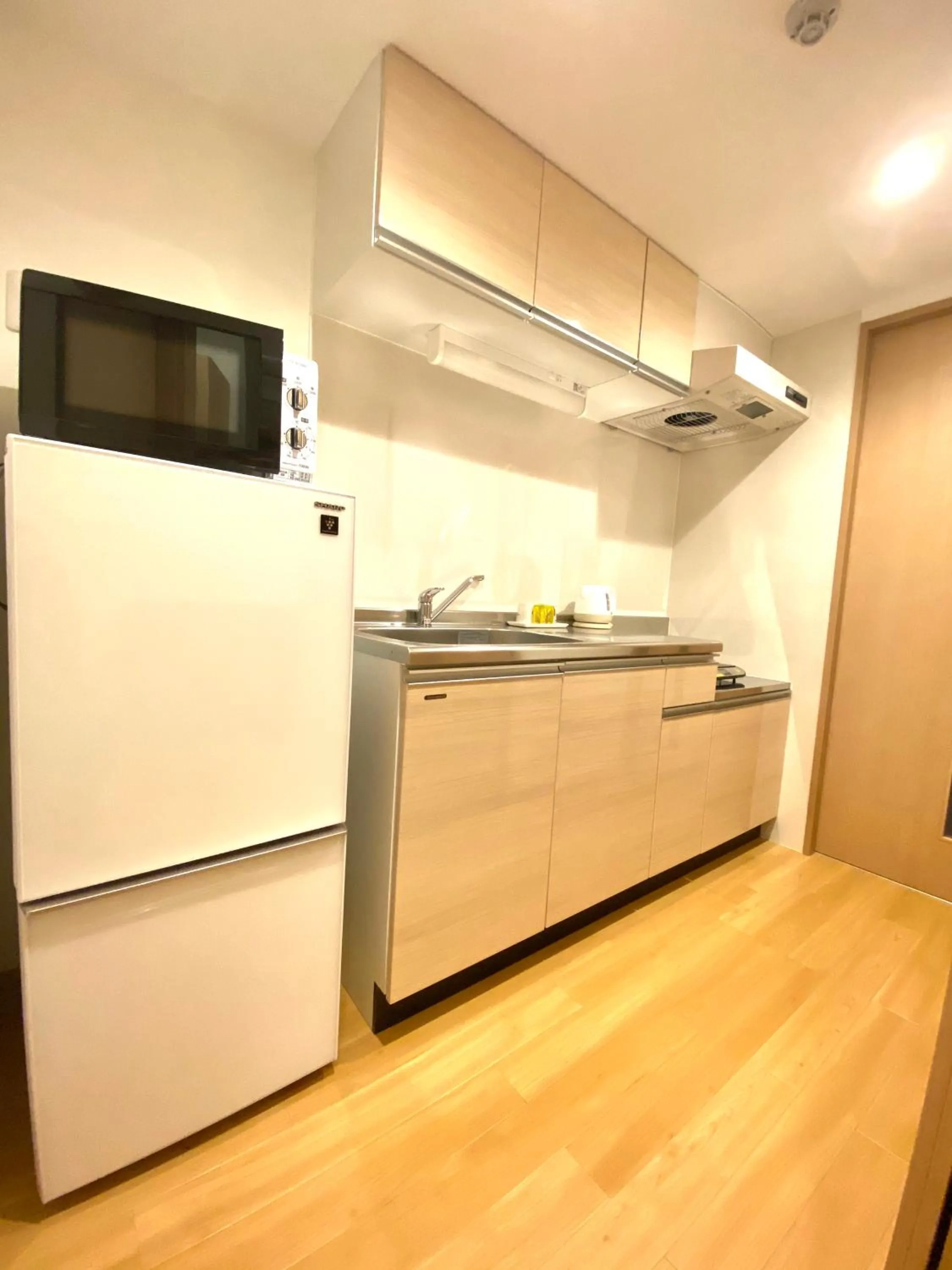 Kitchen or kitchenette in M´s Stay Okinawa