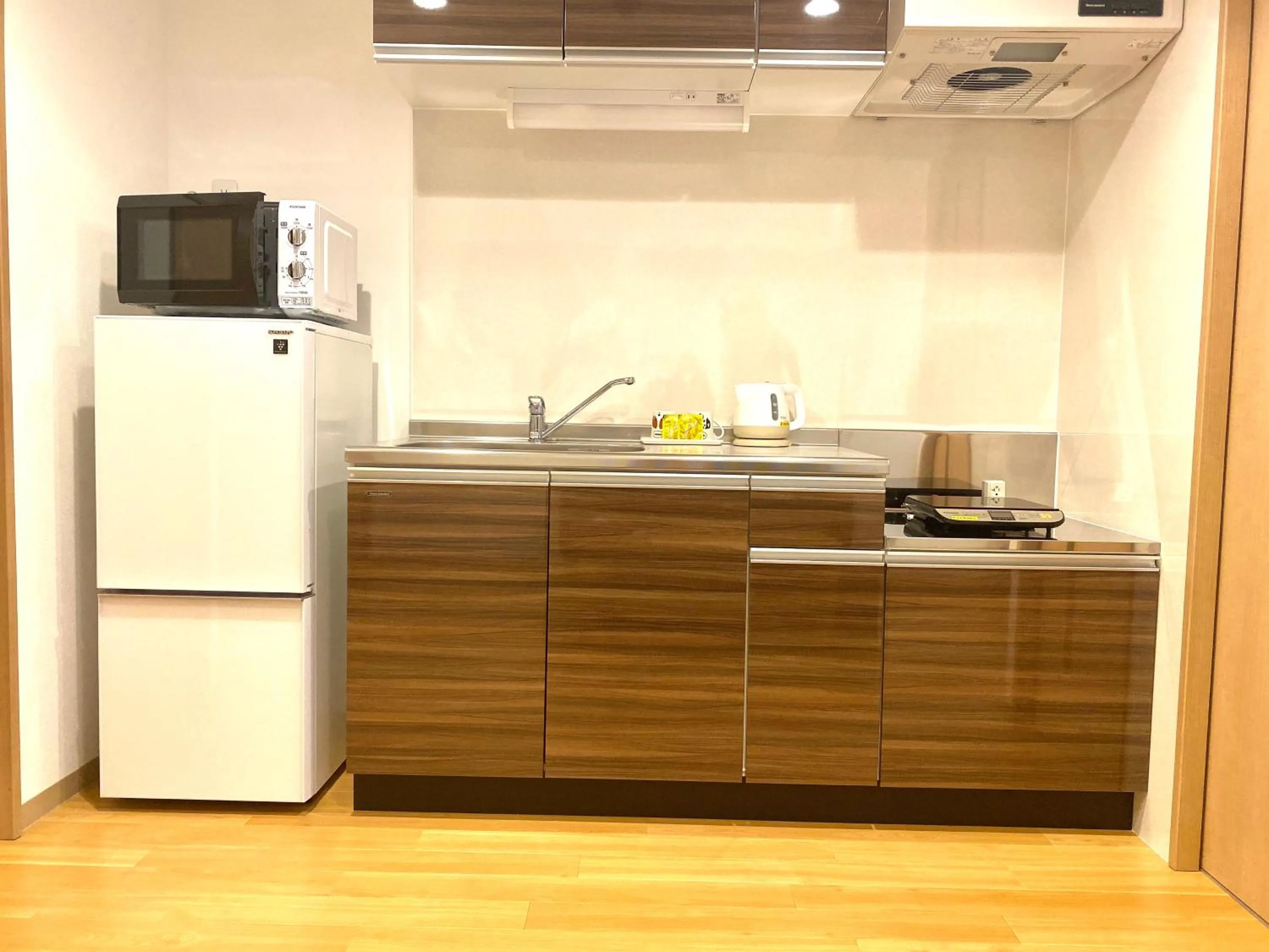 Kitchen or kitchenette in M´s Stay Okinawa