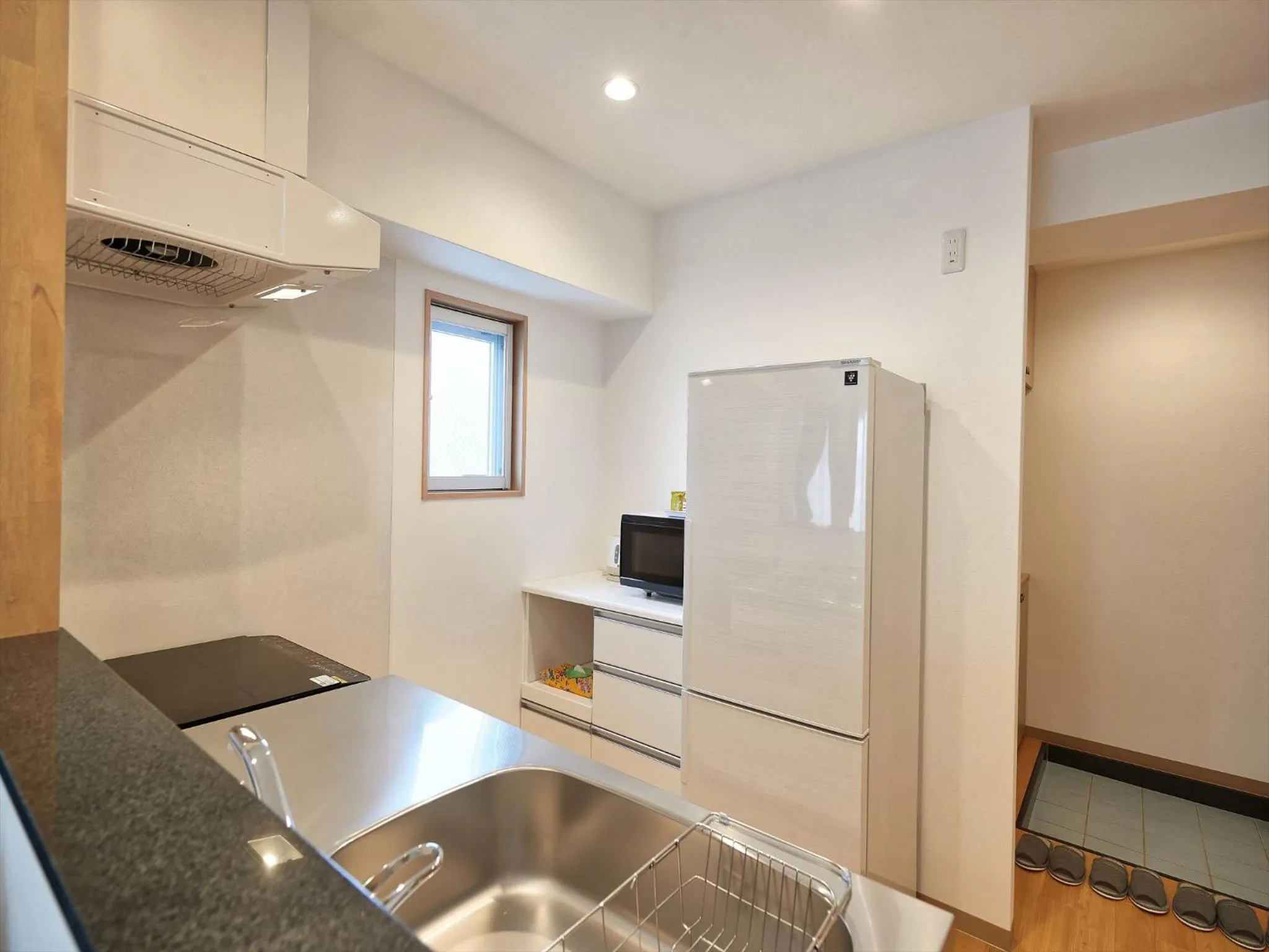 Kitchen or kitchenette in M´s Stay Okinawa