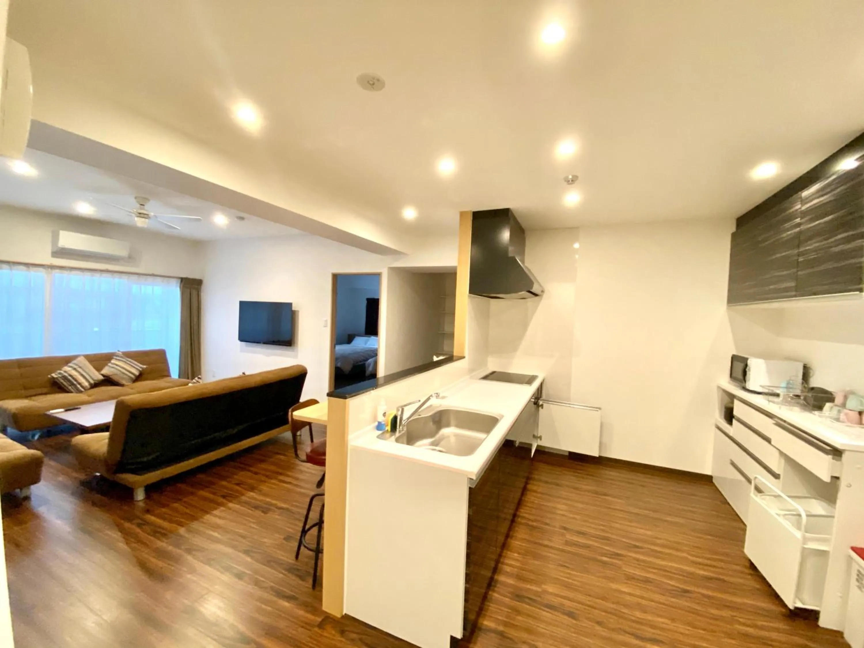 Living room, Bed in M´s Stay Okinawa