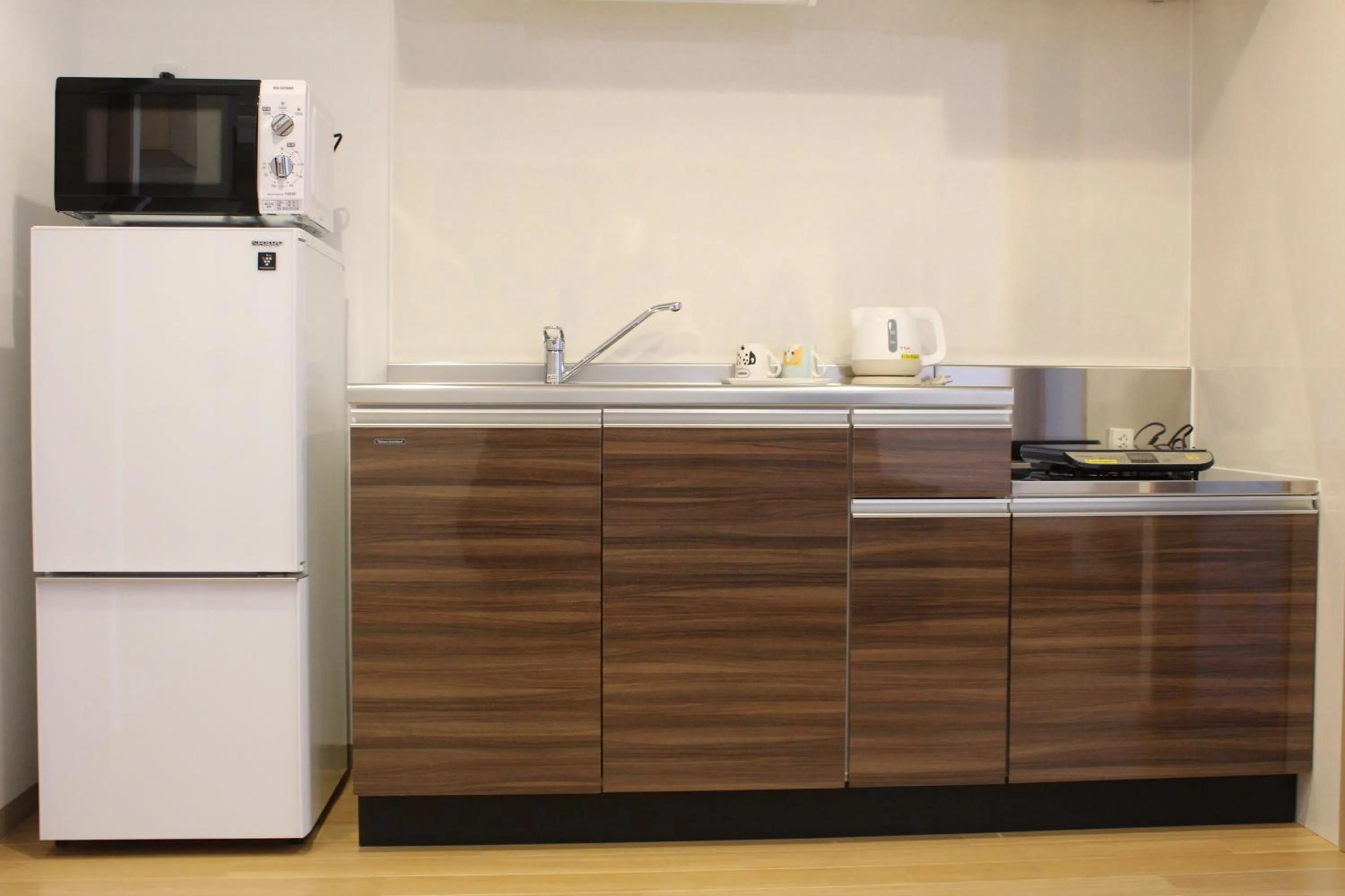 Kitchen or kitchenette in M´s Stay Okinawa