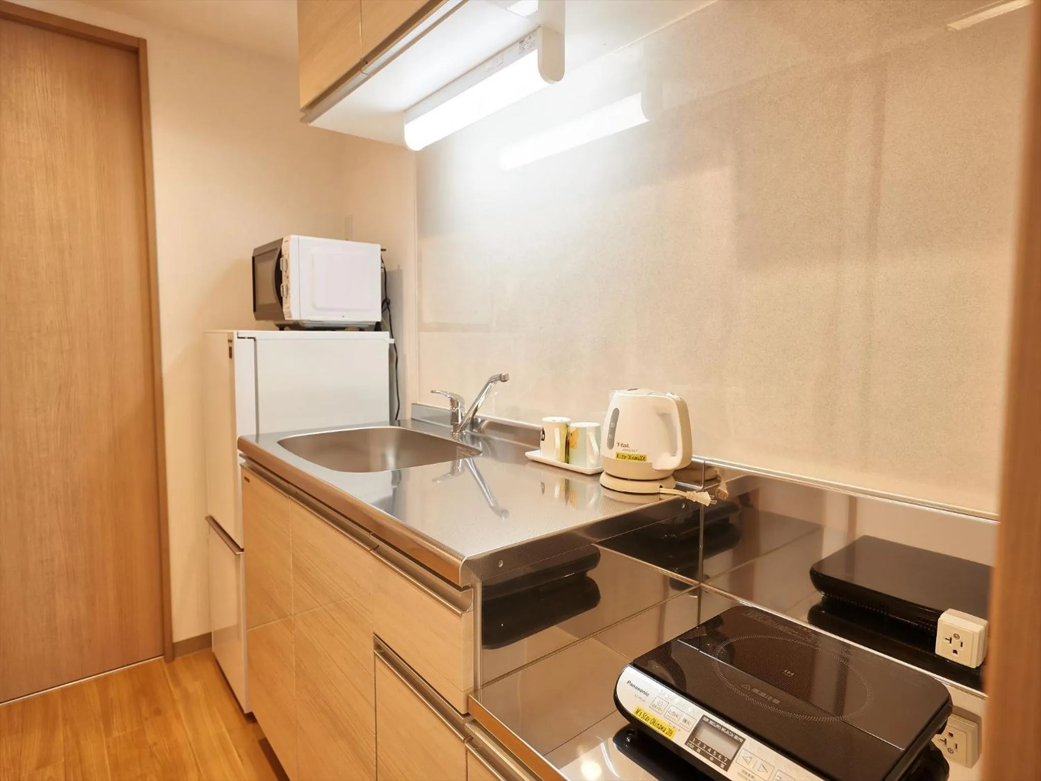 Kitchen or kitchenette in M´s Stay Okinawa