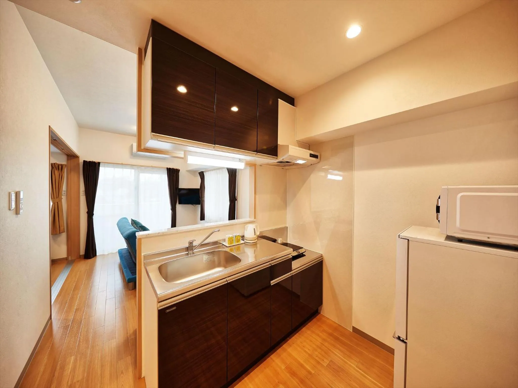Kitchen or kitchenette in M´s Stay Okinawa