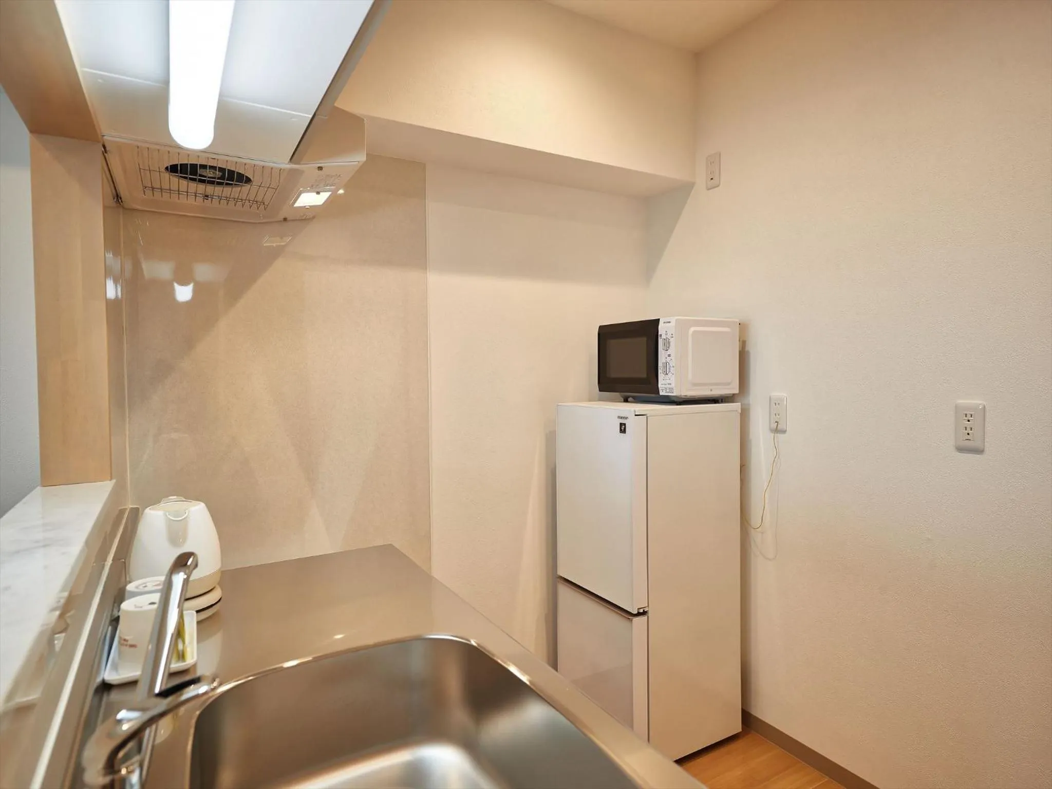 Kitchen or kitchenette in M´s Stay Okinawa