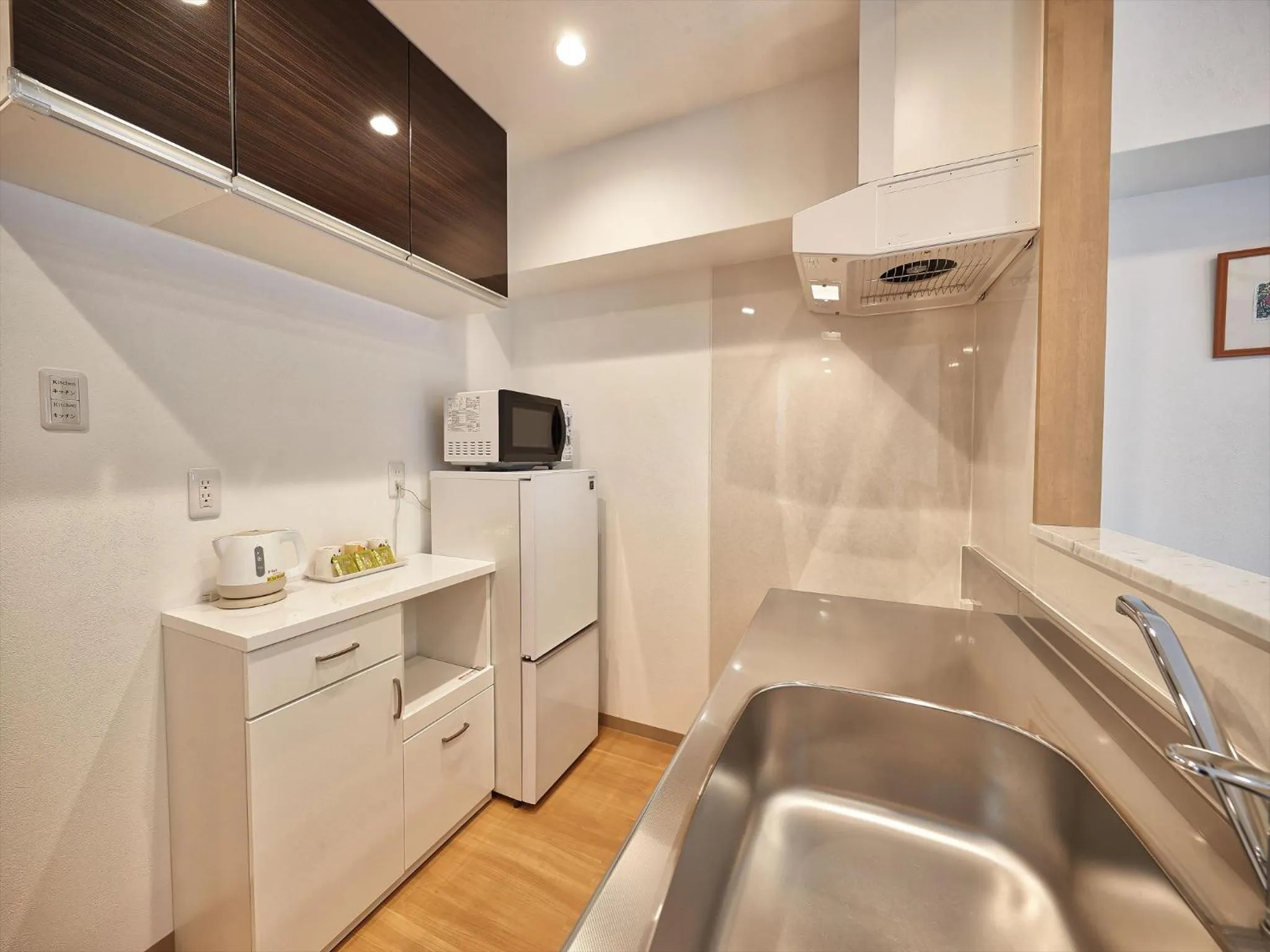 Kitchen or kitchenette in M´s Stay Okinawa