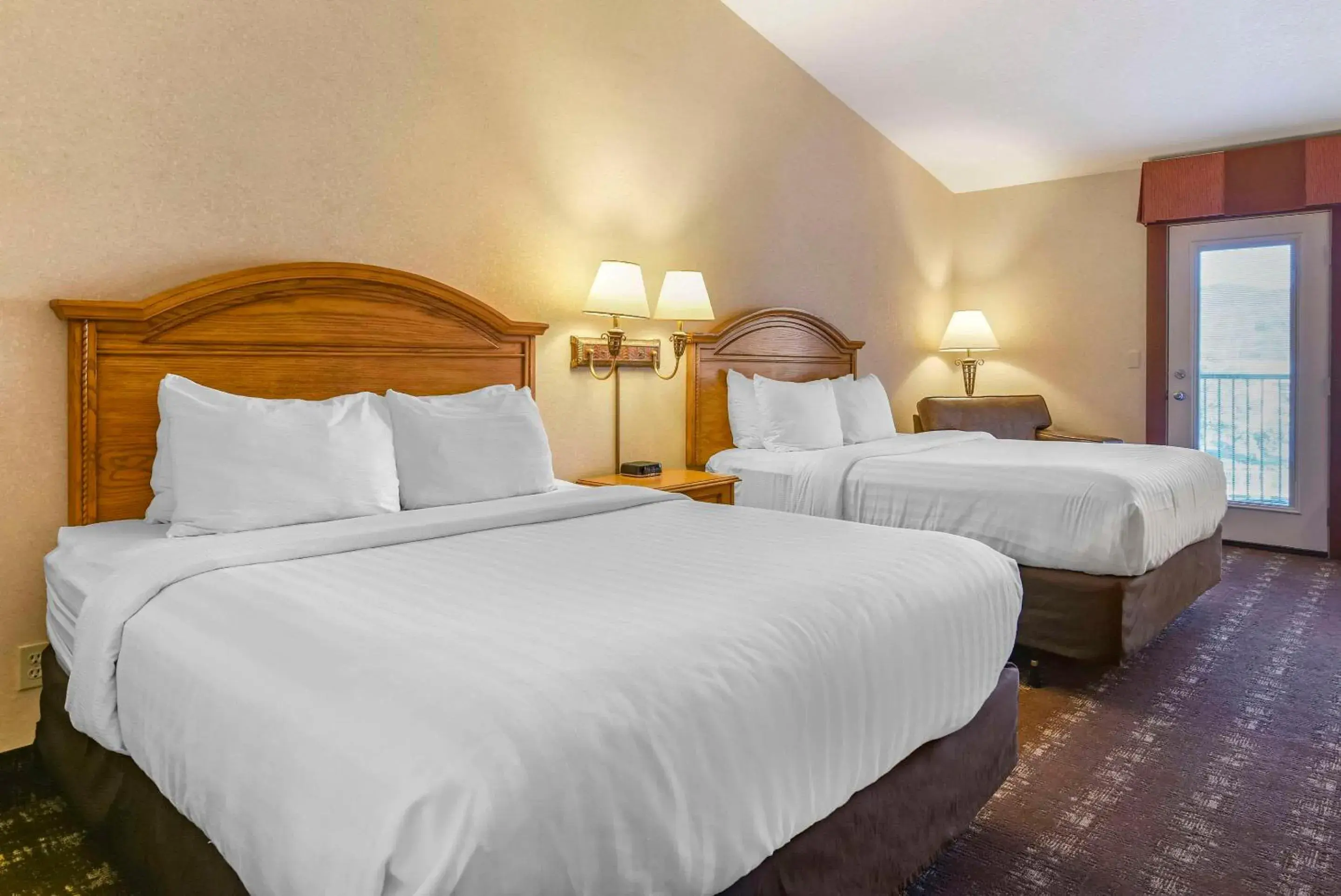 Queen Room with Two Queen Beds with Balcony in Kathryn Riverfront Inn, an Ascend Collection Hotel Queen Room with Two Queen Beds with Balcony in Kathryn Riverfront Inn, an Ascend Collection Hotel