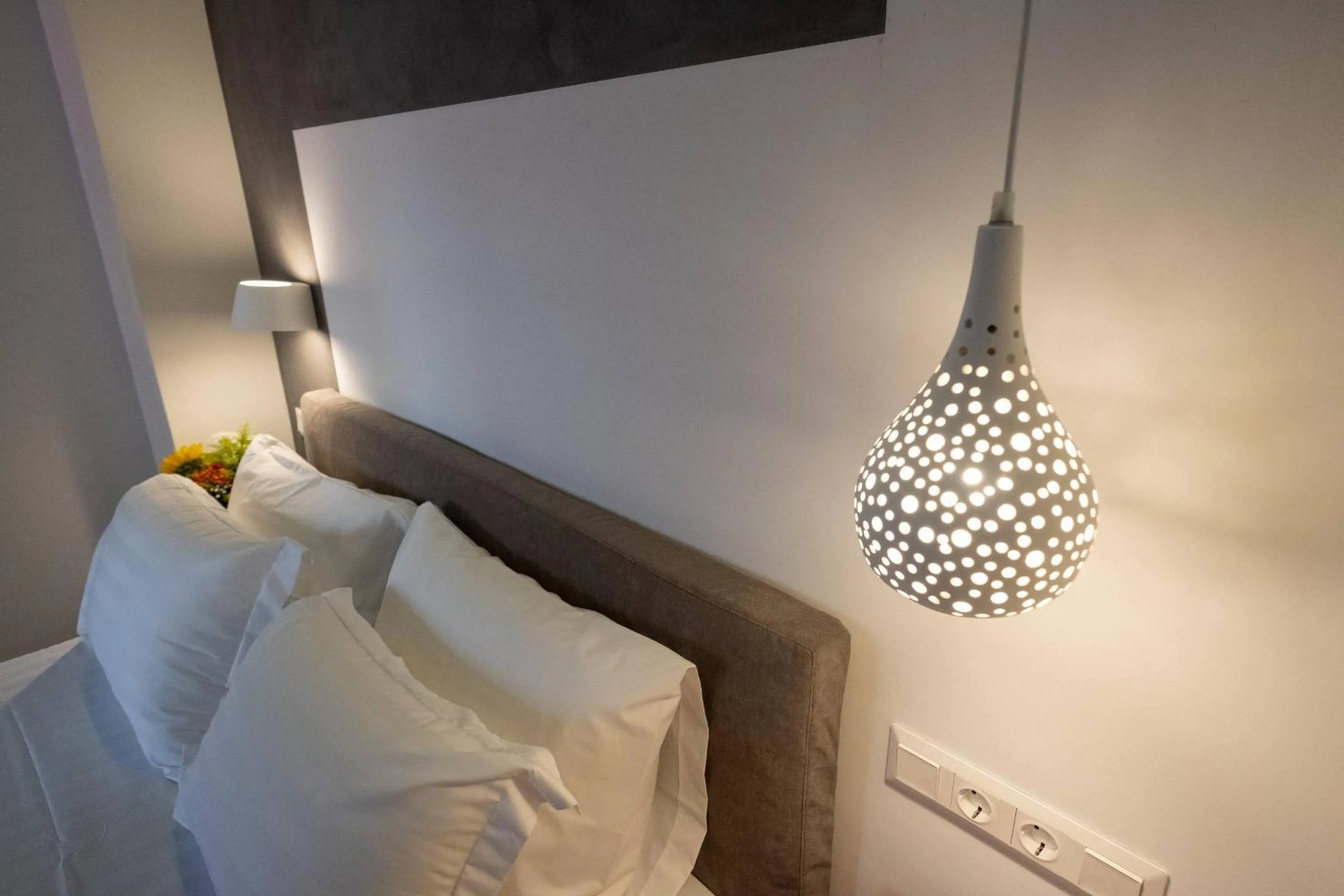 Bed in ATHENIAN YARD SUITES