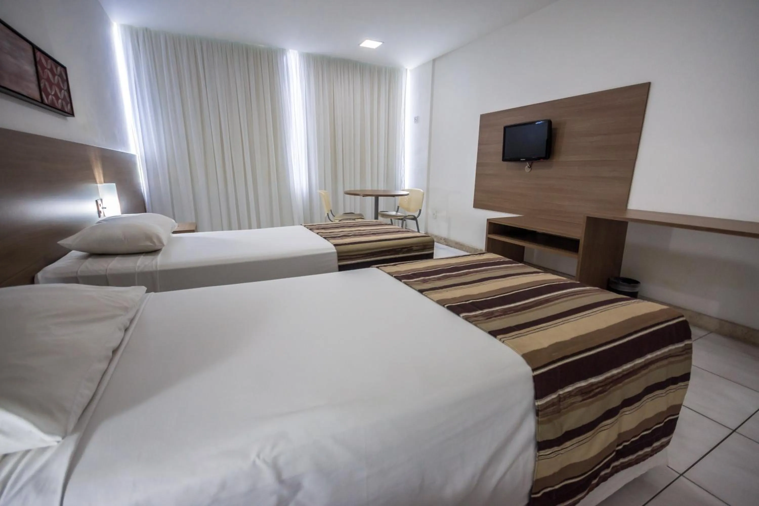 Bed in Cambuci Hotel