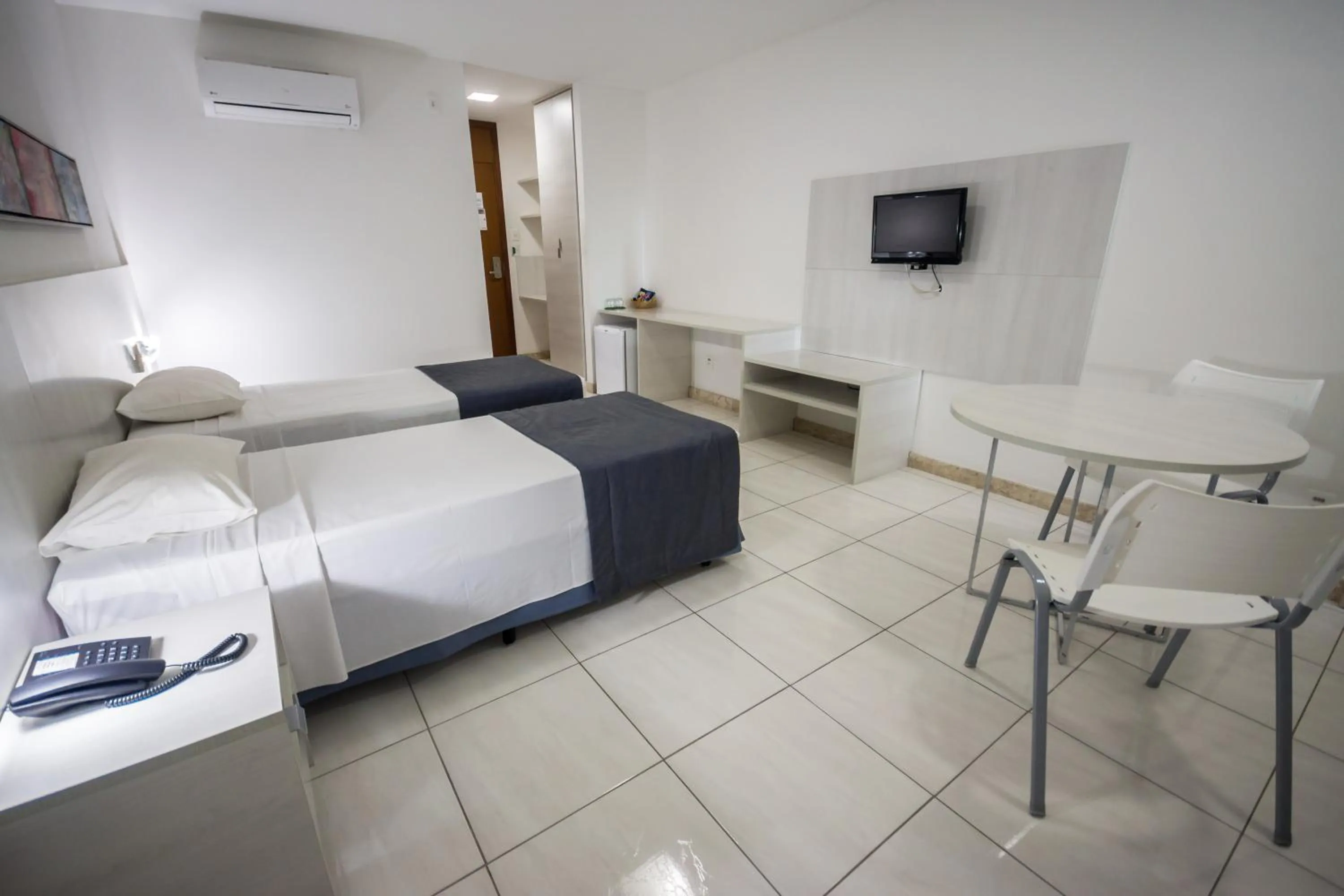 Bed in Cambuci Hotel