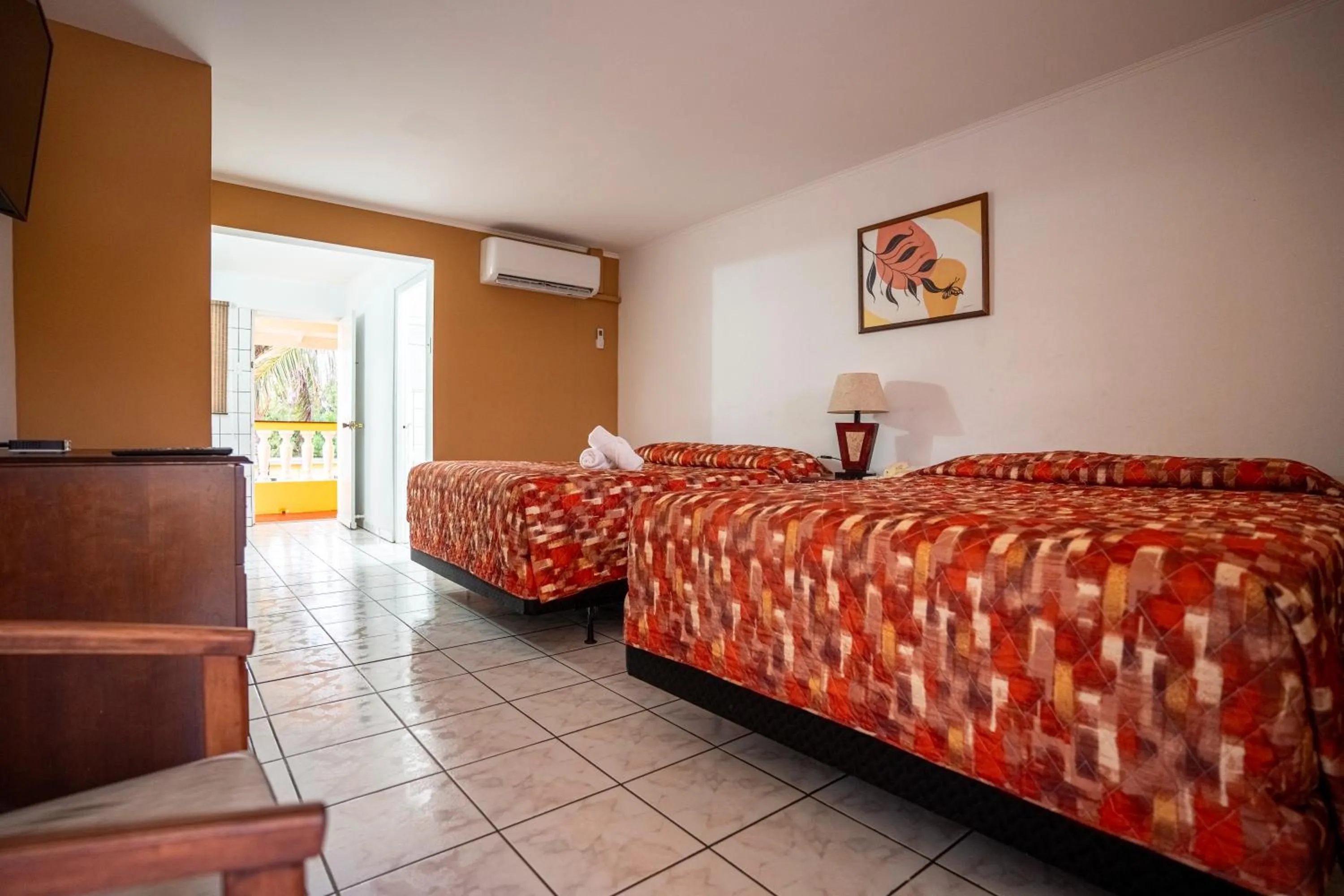 Photo of the whole room, Bed in Coconut Inn