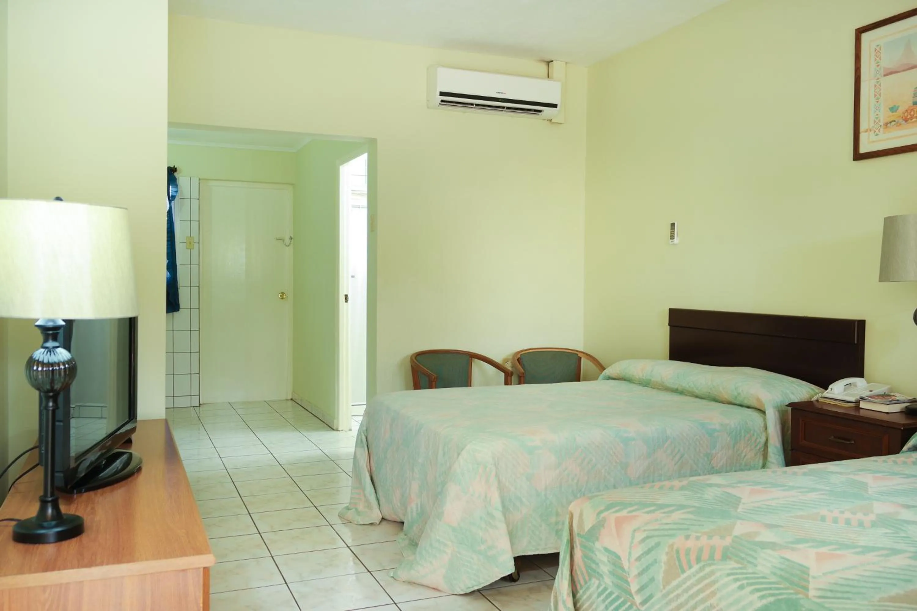 Photo of the whole room, Bed in Coconut Inn