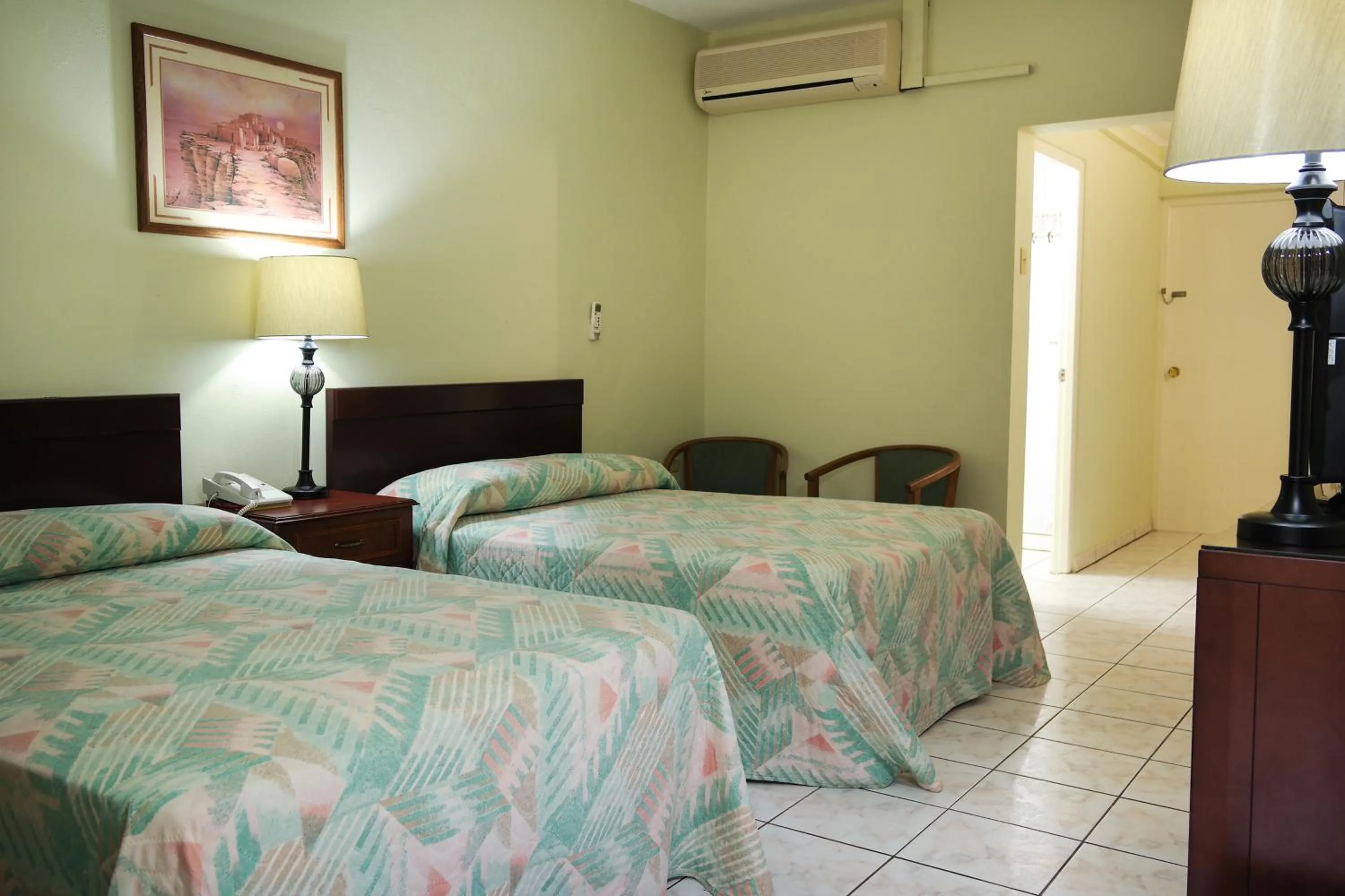 Photo of the whole room, Bed in Coconut Inn
