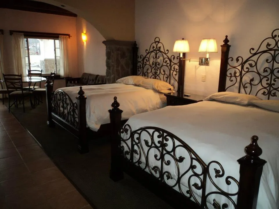 Bed in Hotel Quinta Mision