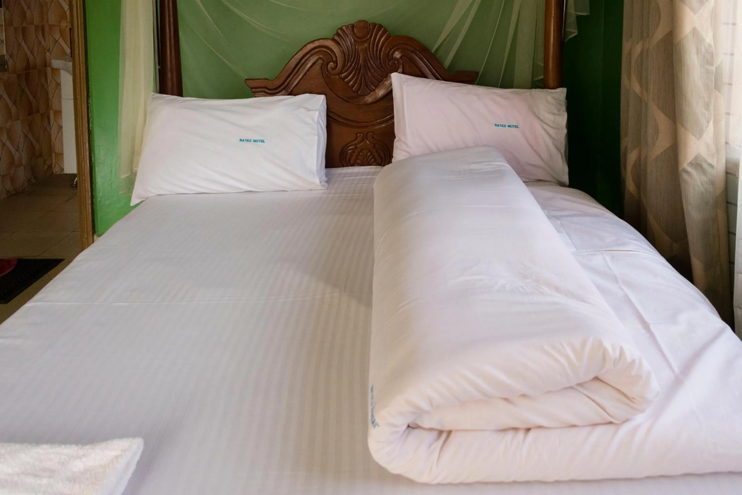 Photo of the whole room, Bed in Rates Motel Mbale
