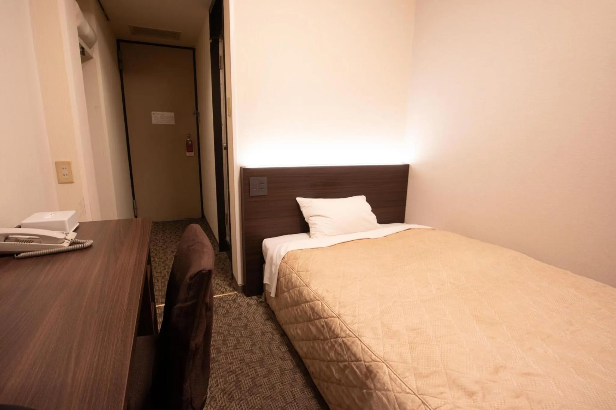 Bed in Hotel Aisul Matsuyama