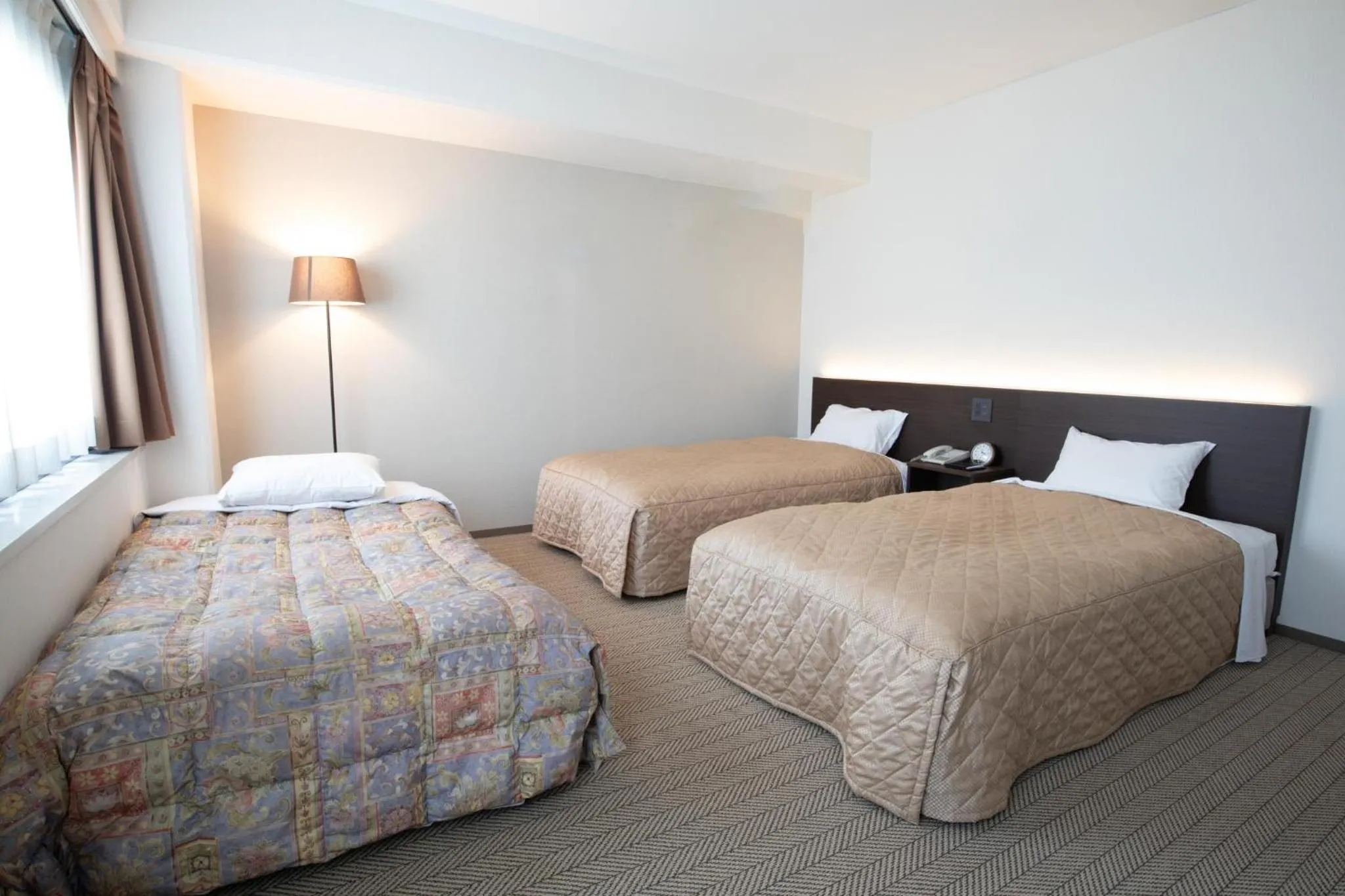 Bed in Hotel Aisul Matsuyama