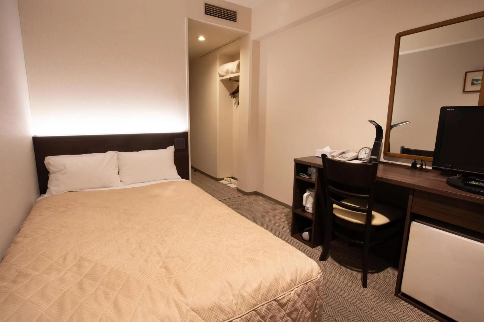 Bed in Hotel Aisul Matsuyama