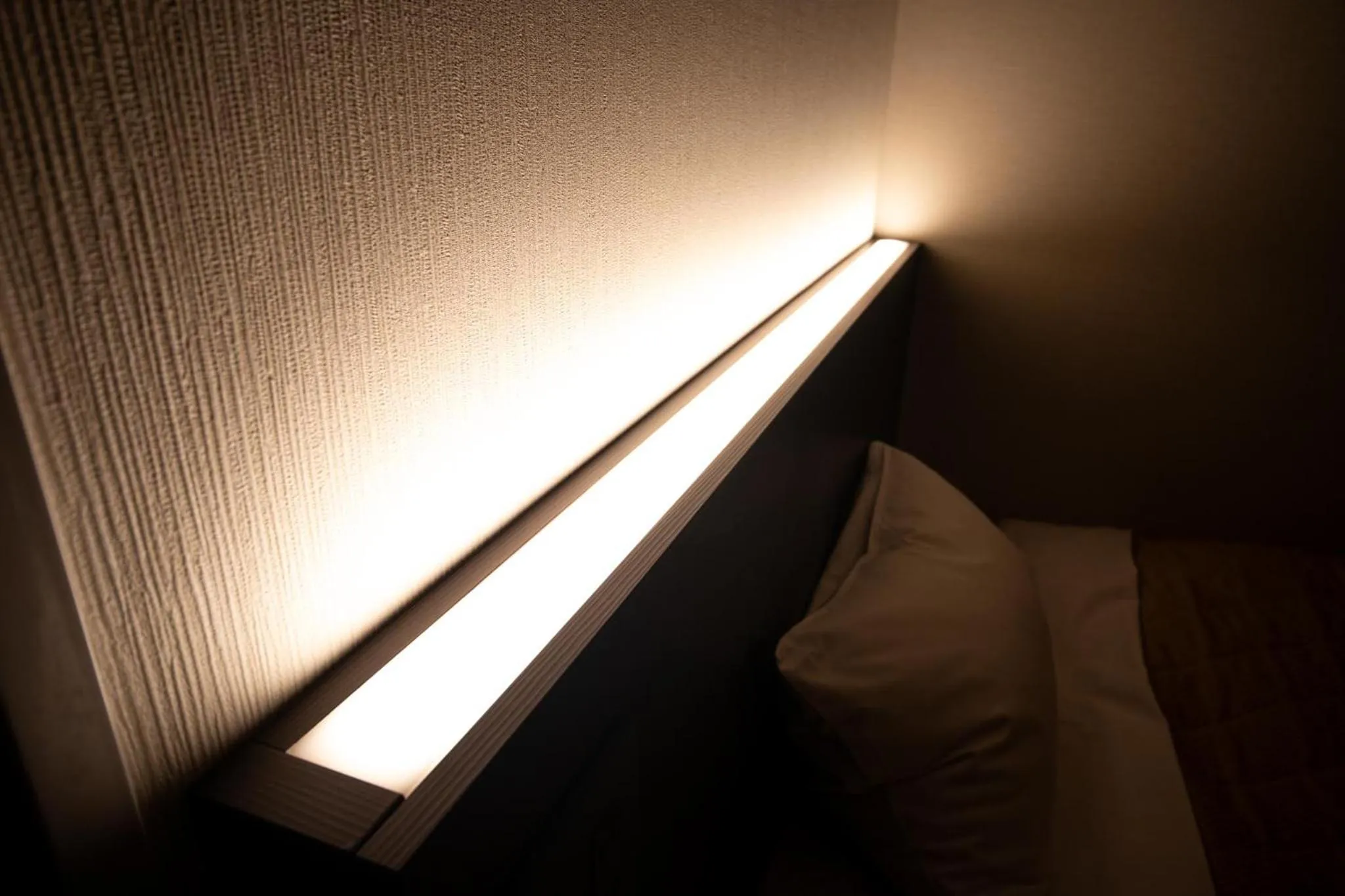 Bed in Hotel Aisul Matsuyama