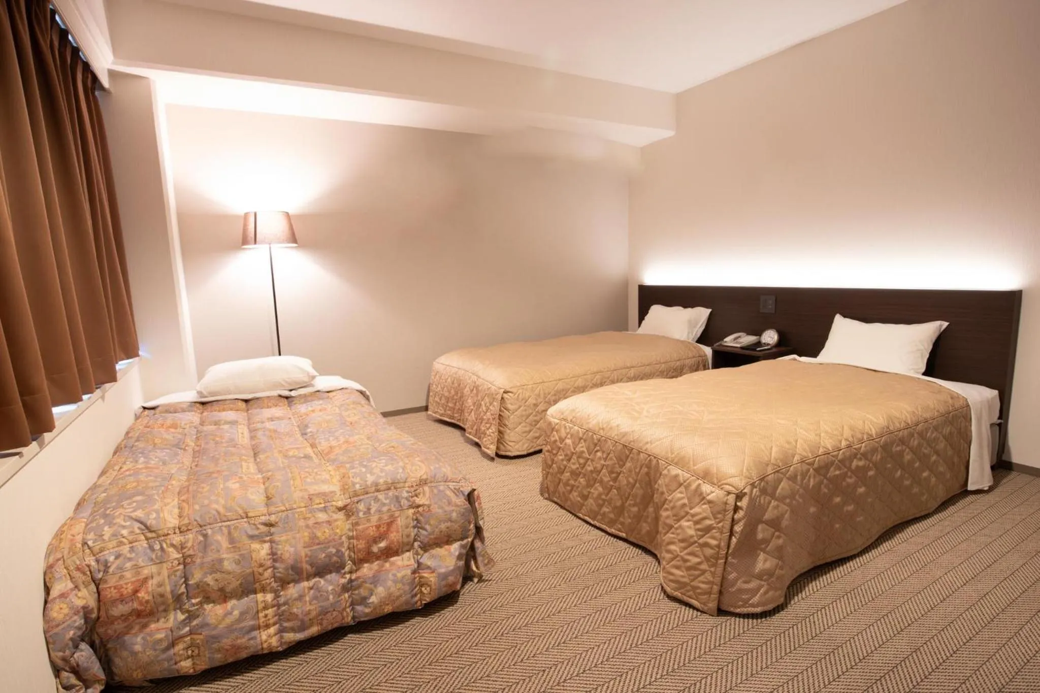 Bed in Hotel Aisul Matsuyama