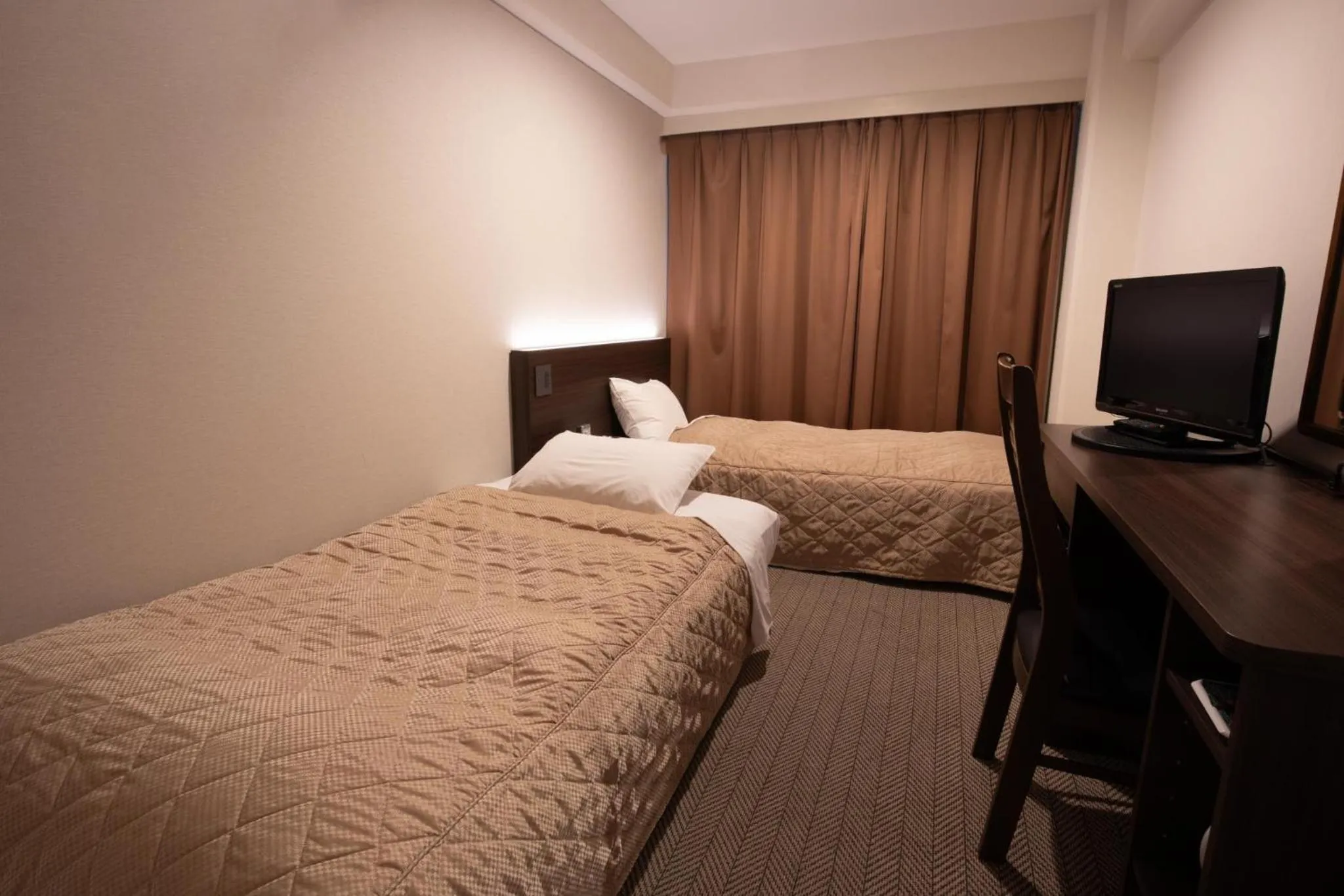 Bed in Hotel Aisul Matsuyama