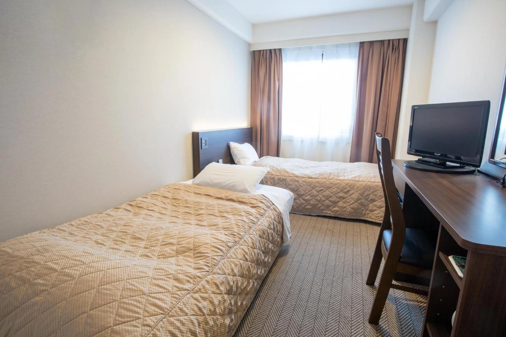 Bed in Hotel Aisul Matsuyama