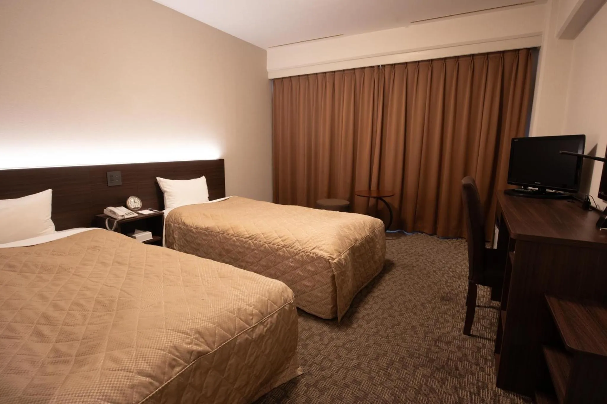 Bed in Hotel Aisul Matsuyama