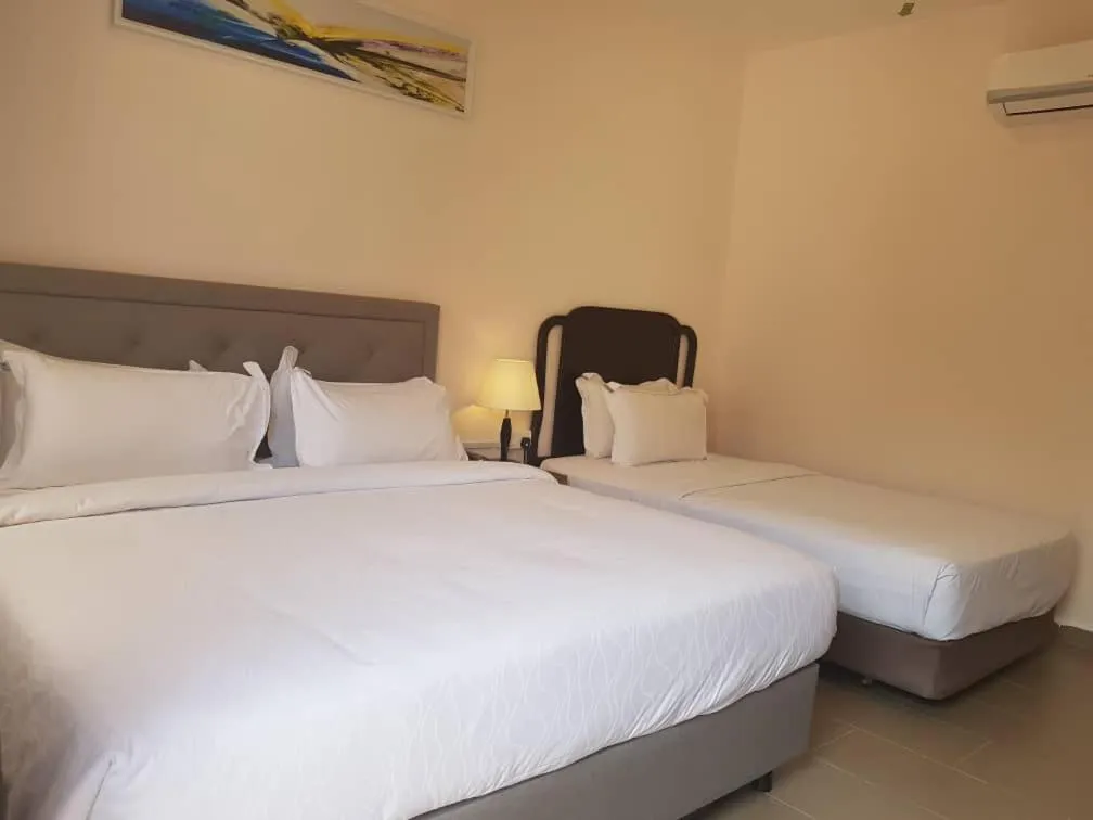 Bed in Lotus Seaview Beach Resort, Pengerang