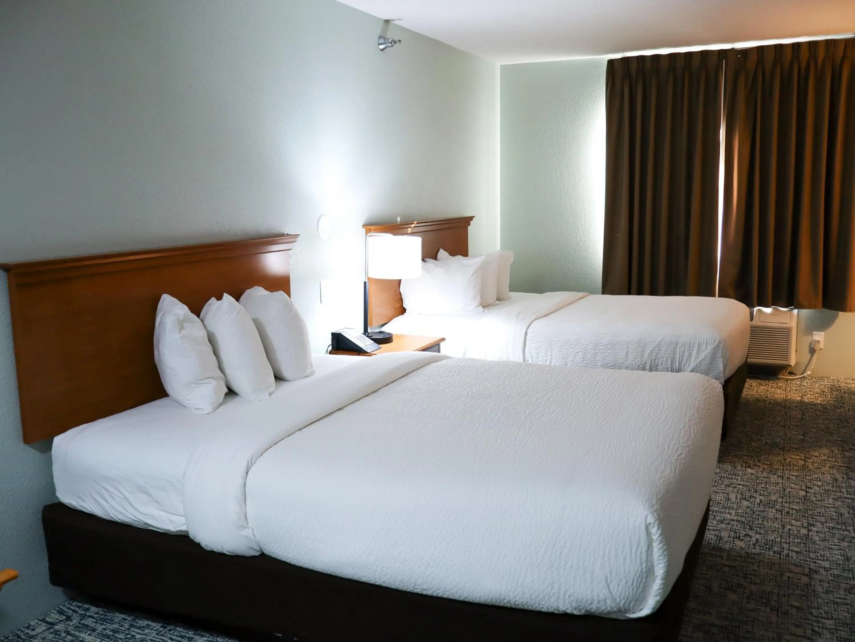 Bed in Travelodge by Wyndham Rapid City - Black Hills