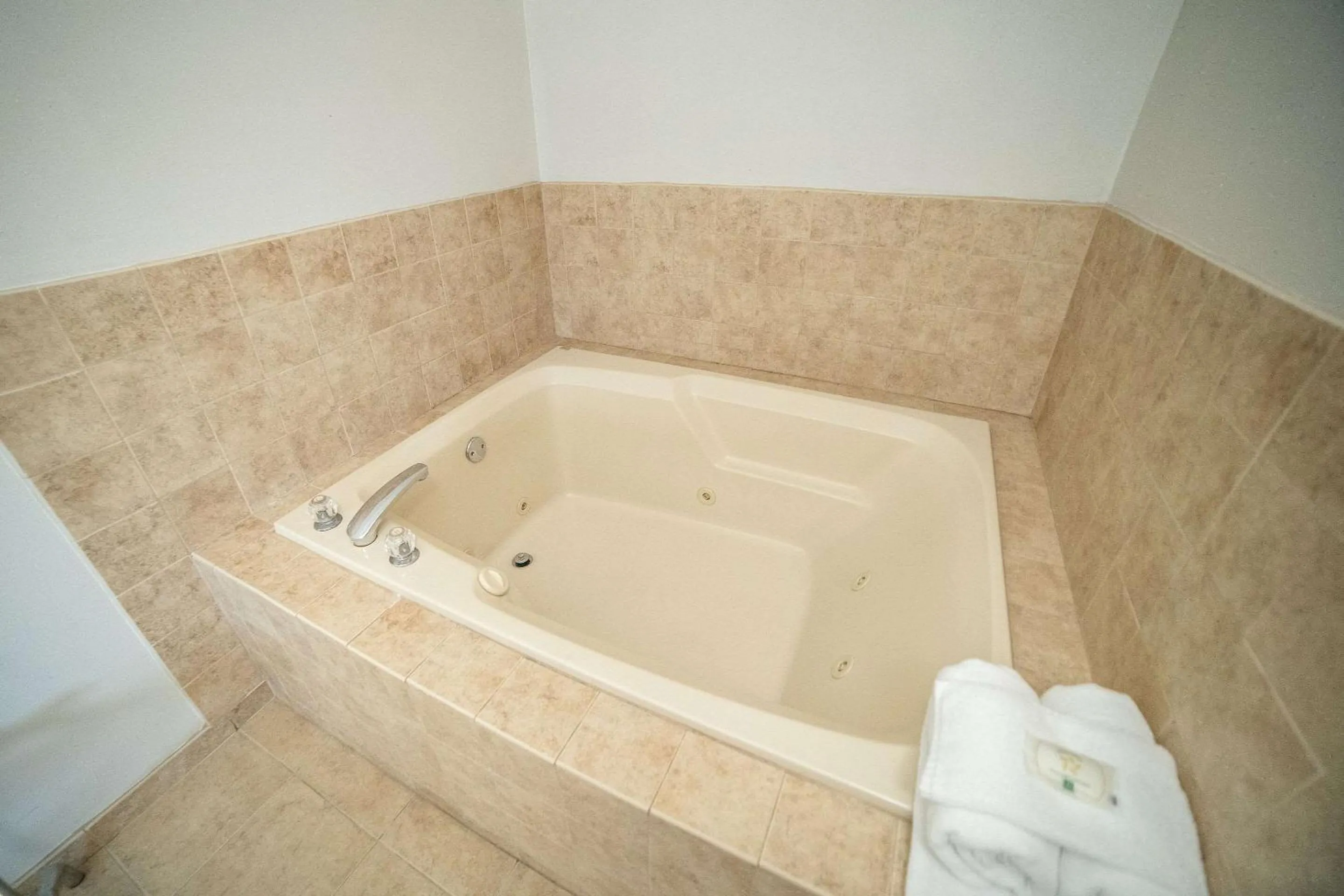 Bedroom in Quality Inn & Suites Watertown near Prairie Lakes Ice Arena