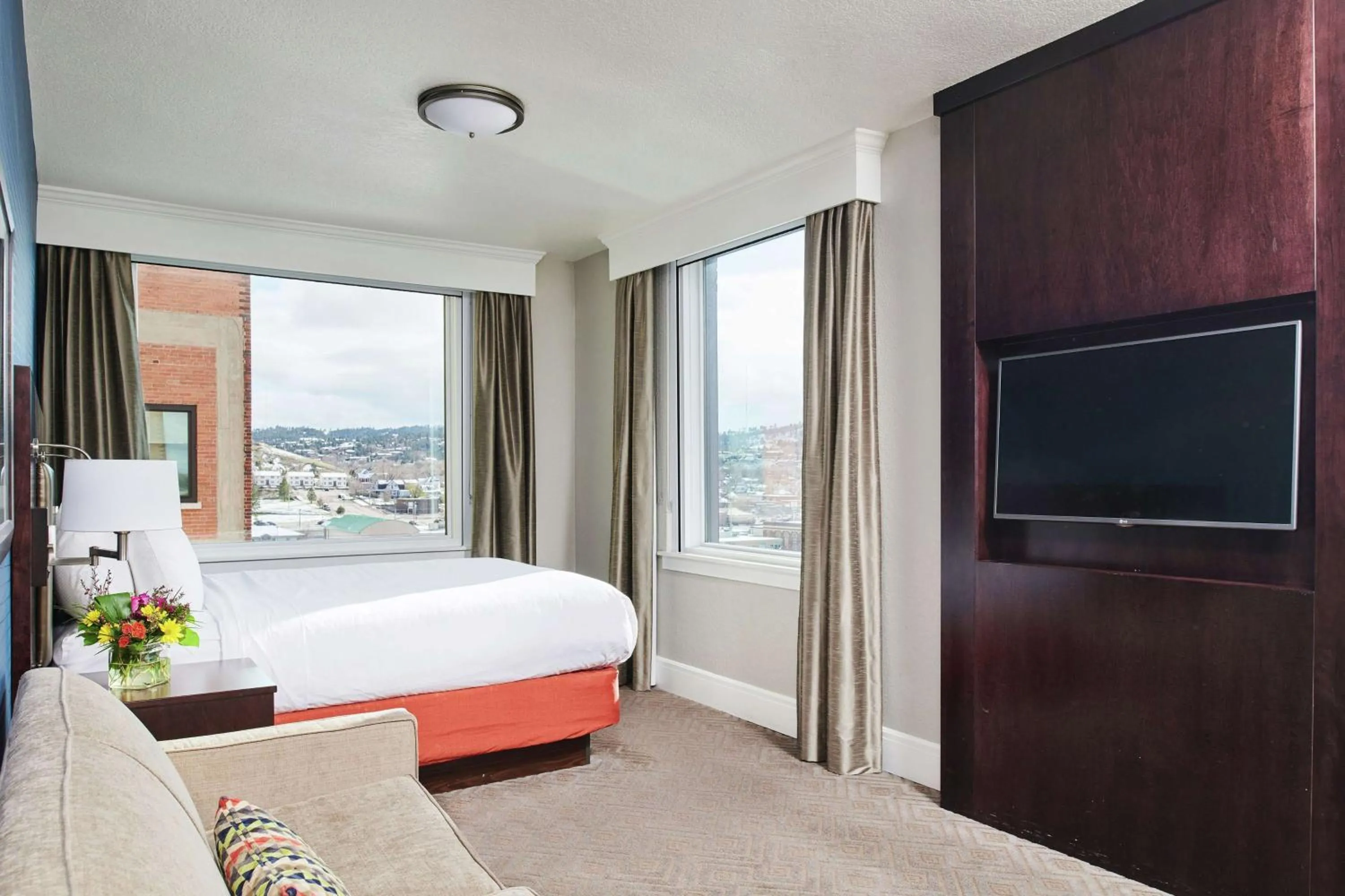 Living room, Bed in Hotel Alex Johnson Rapid City, Curio Collection by Hilton