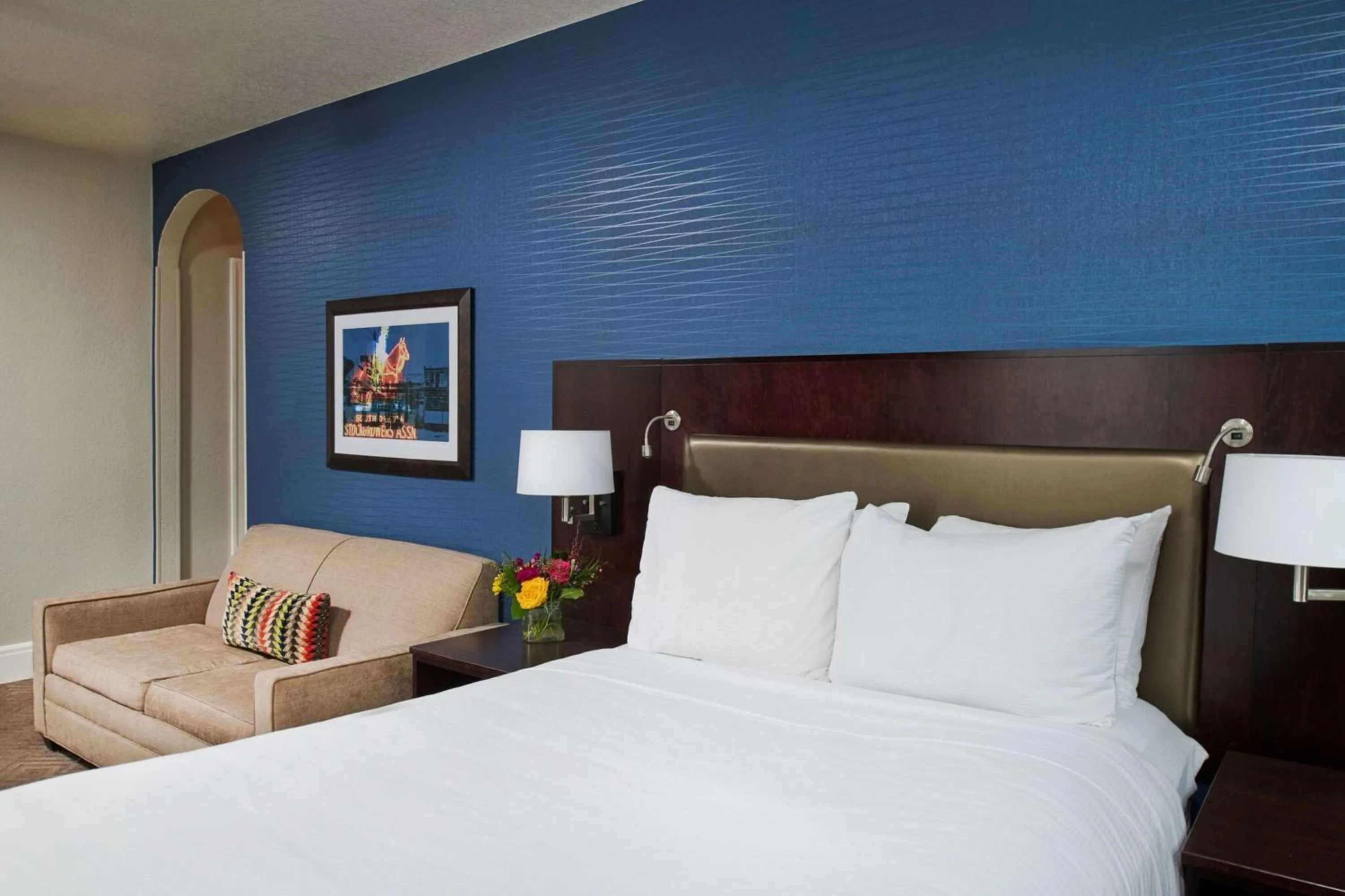 Living room, Bed in Hotel Alex Johnson Rapid City, Curio Collection by Hilton