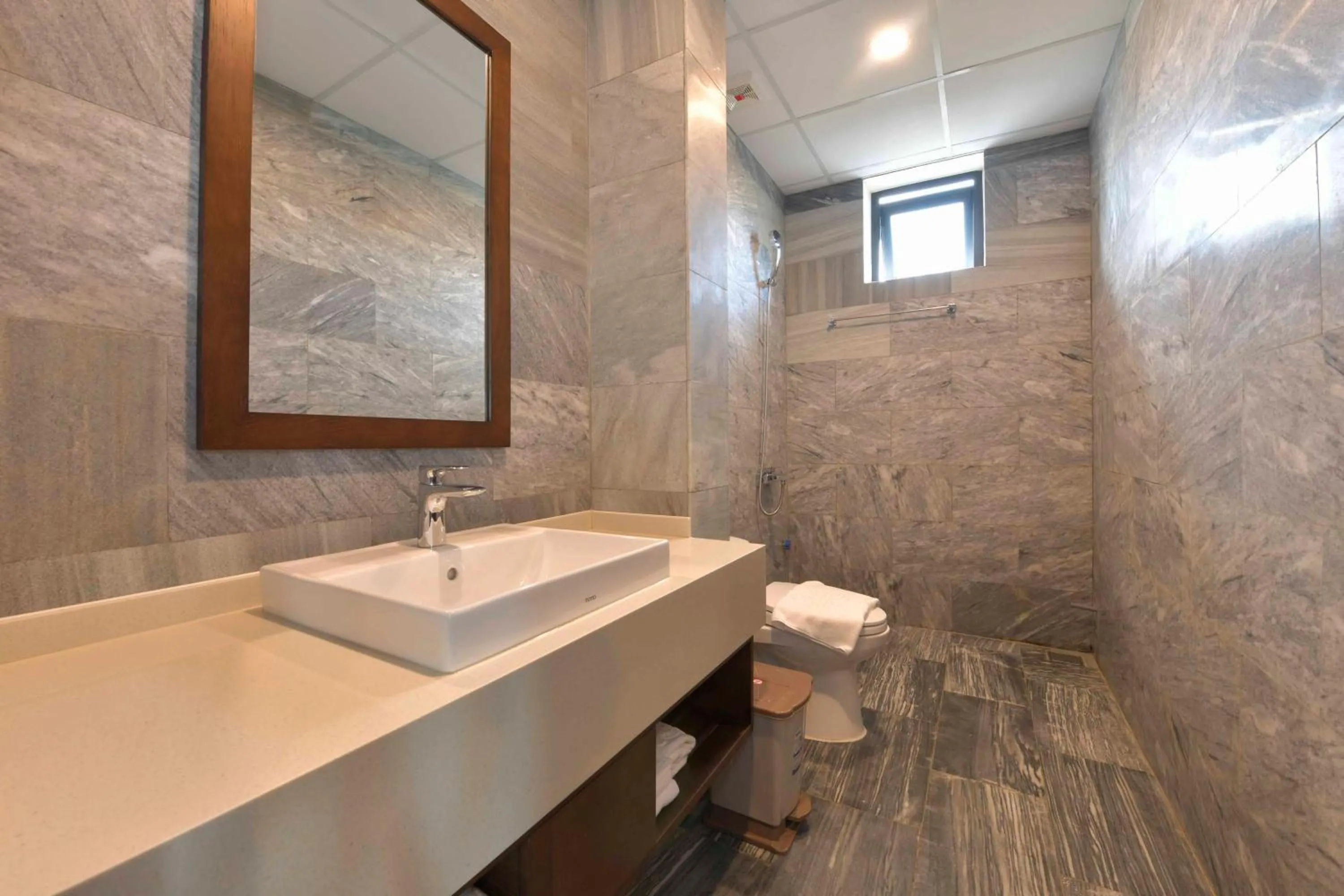 Shower in CocoLand Thu Xa Ancient Town Resort