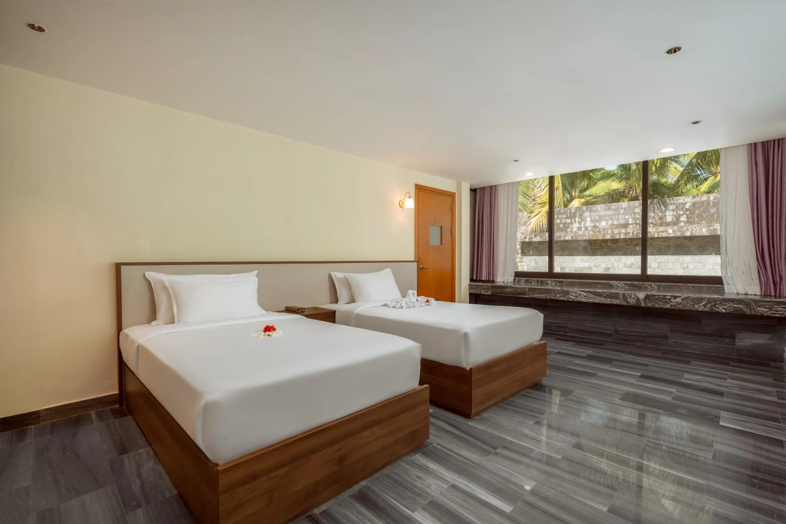 Photo of the whole room, Bed in CocoLand Thu Xa Ancient Town Hotel & Resort