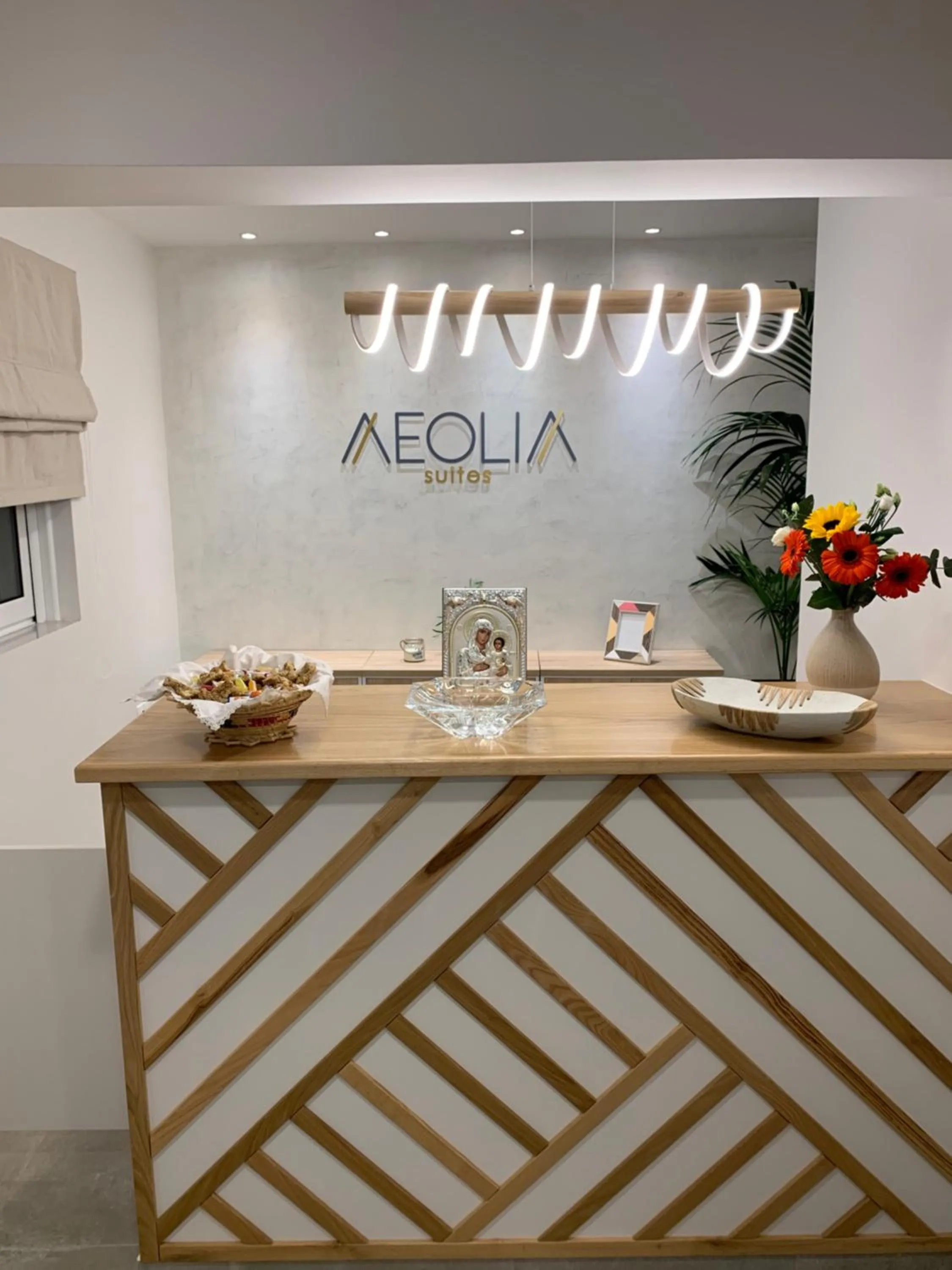 Property logo or sign in Aeolia suites