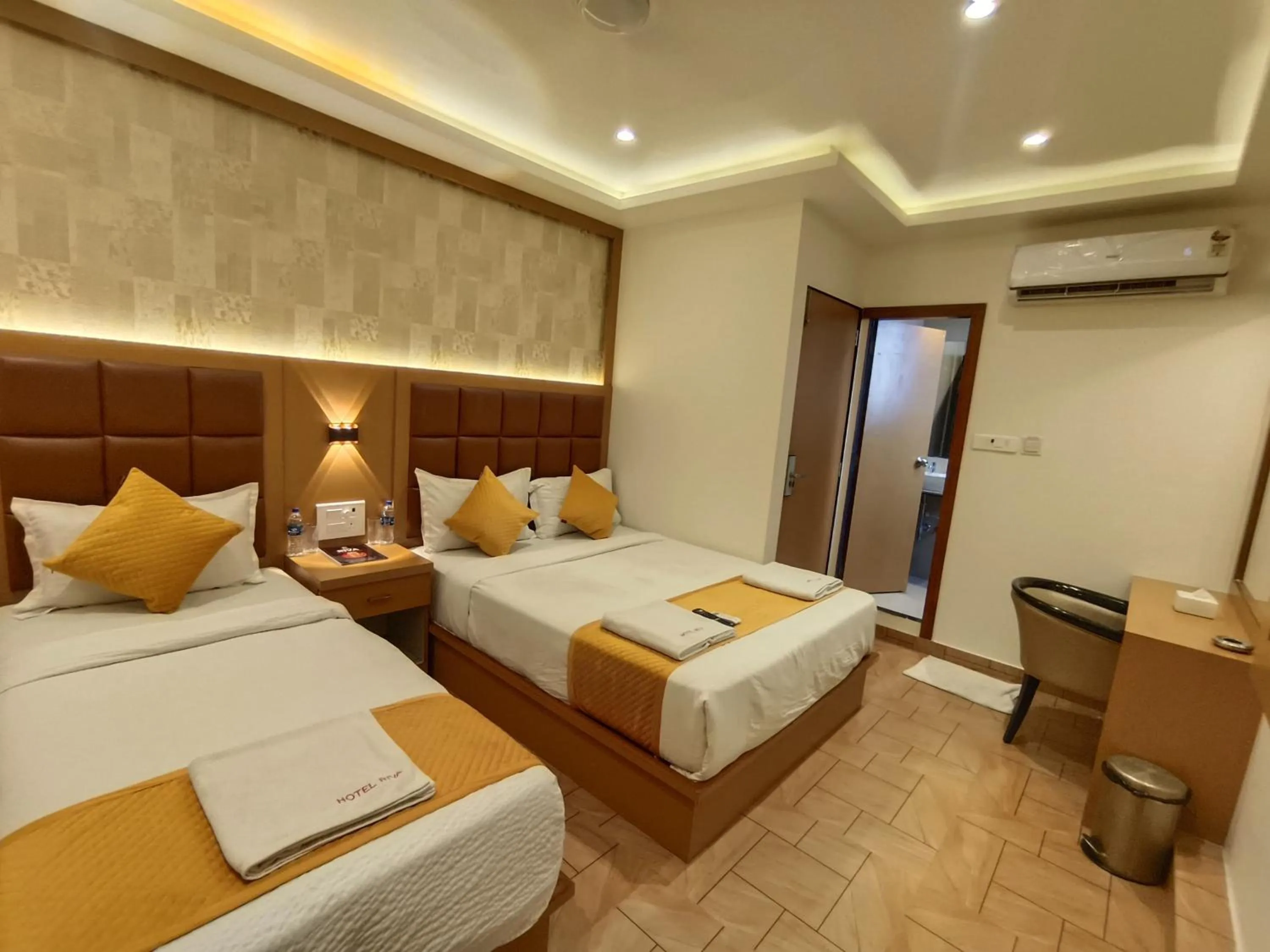 Bed in Hotel Riva International Goregaon- Near NESCO