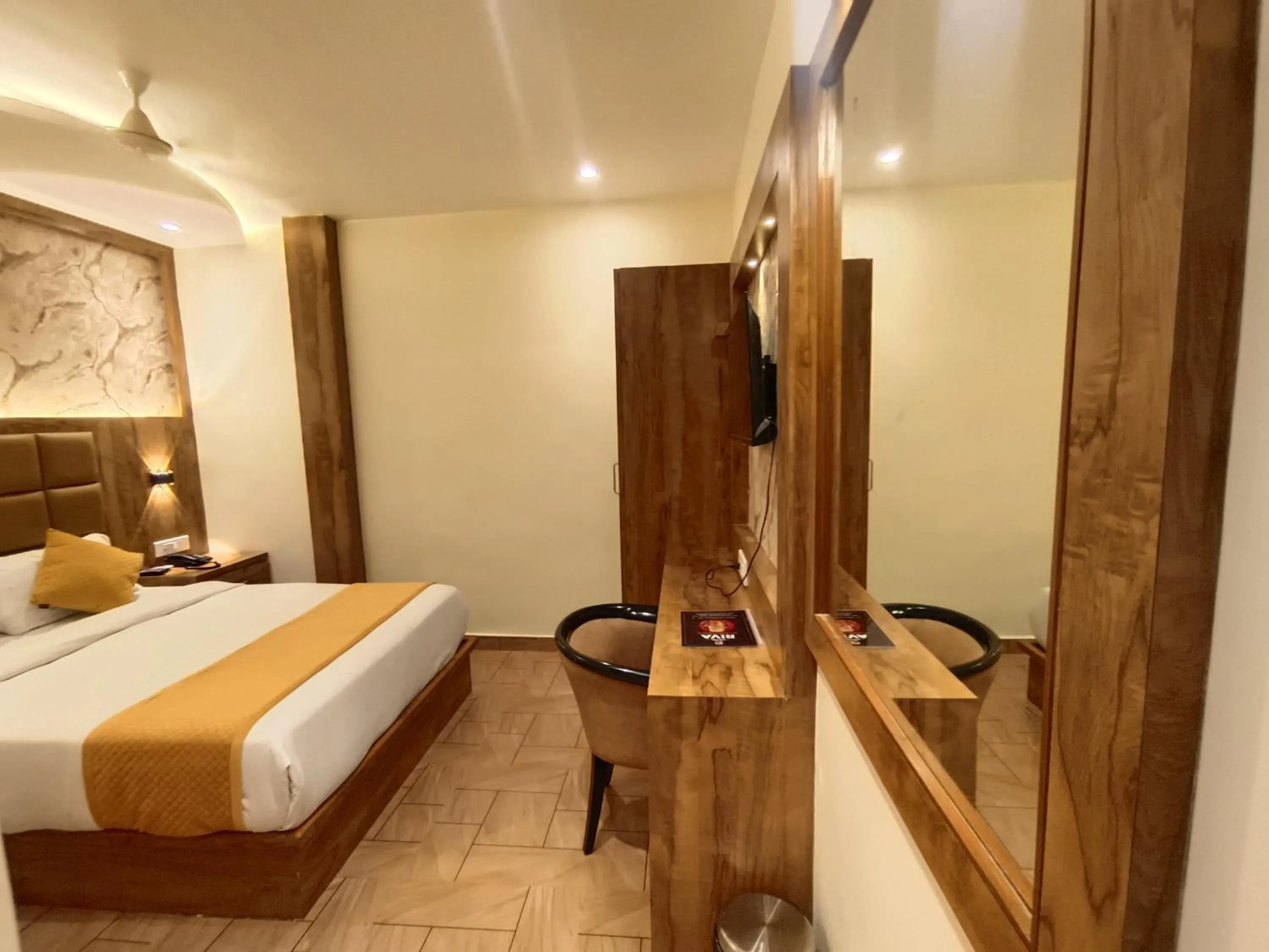 Bed in Hotel Riva International Goregaon- Near NESCO